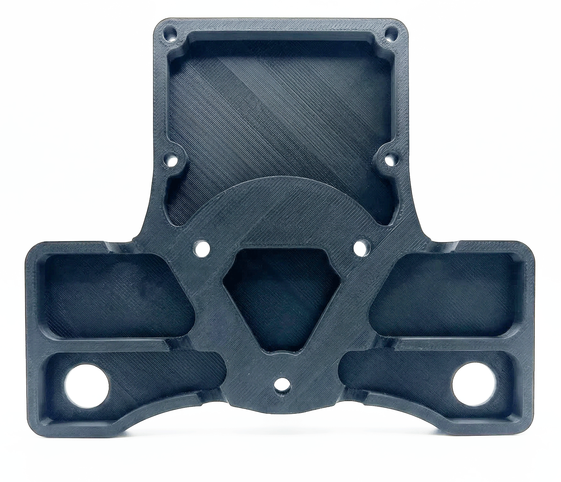 Black 3D-printed mechanical part with multiple holes and cavities, positioned against a white background.