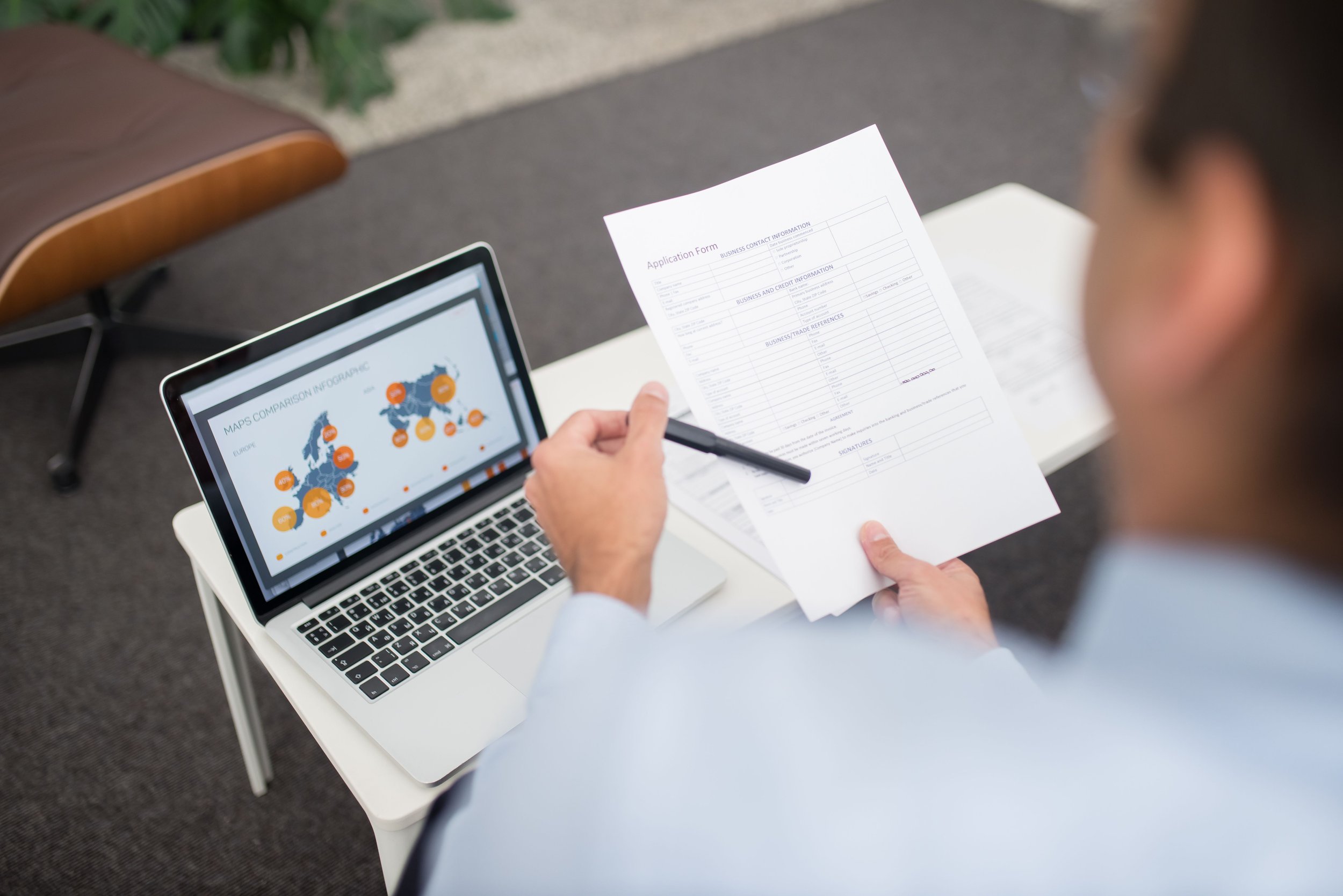 Food company manager reviewing supporting documents for an EcoVadis sustainability assessment
