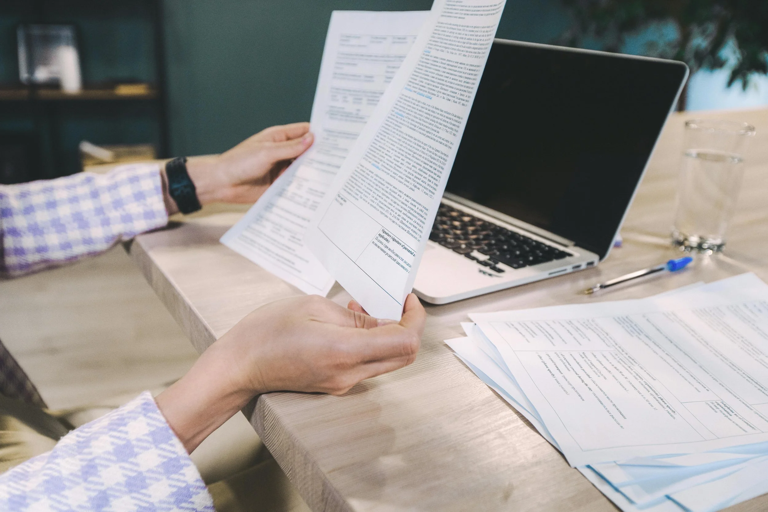 Professional reviewing supporting documents for relevance and scope in an EcoVadis assessment.