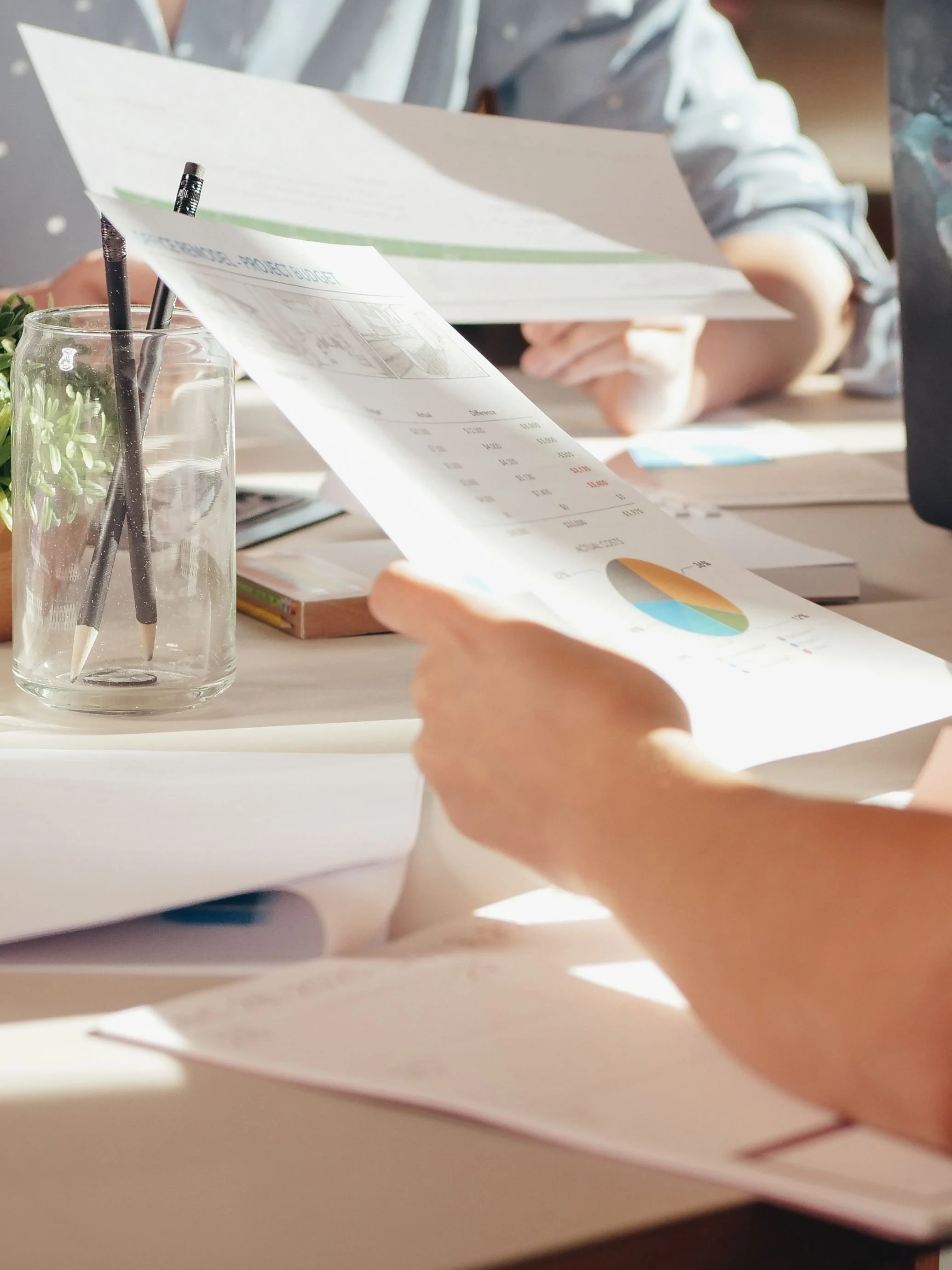 Notes and sustainability documents on a wooden table — ESG document setup for companies