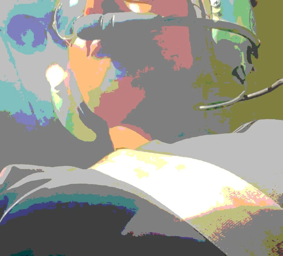 Close-up of a person wearing a headset with a microphone, looking at a computer screen, with brightly colored, digital-style effects.