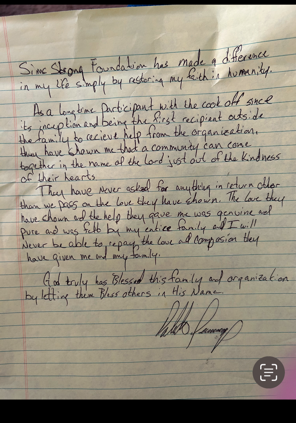 Handwritten note on a yellow lined paper, expressing gratitude and faith, signed at the bottom.