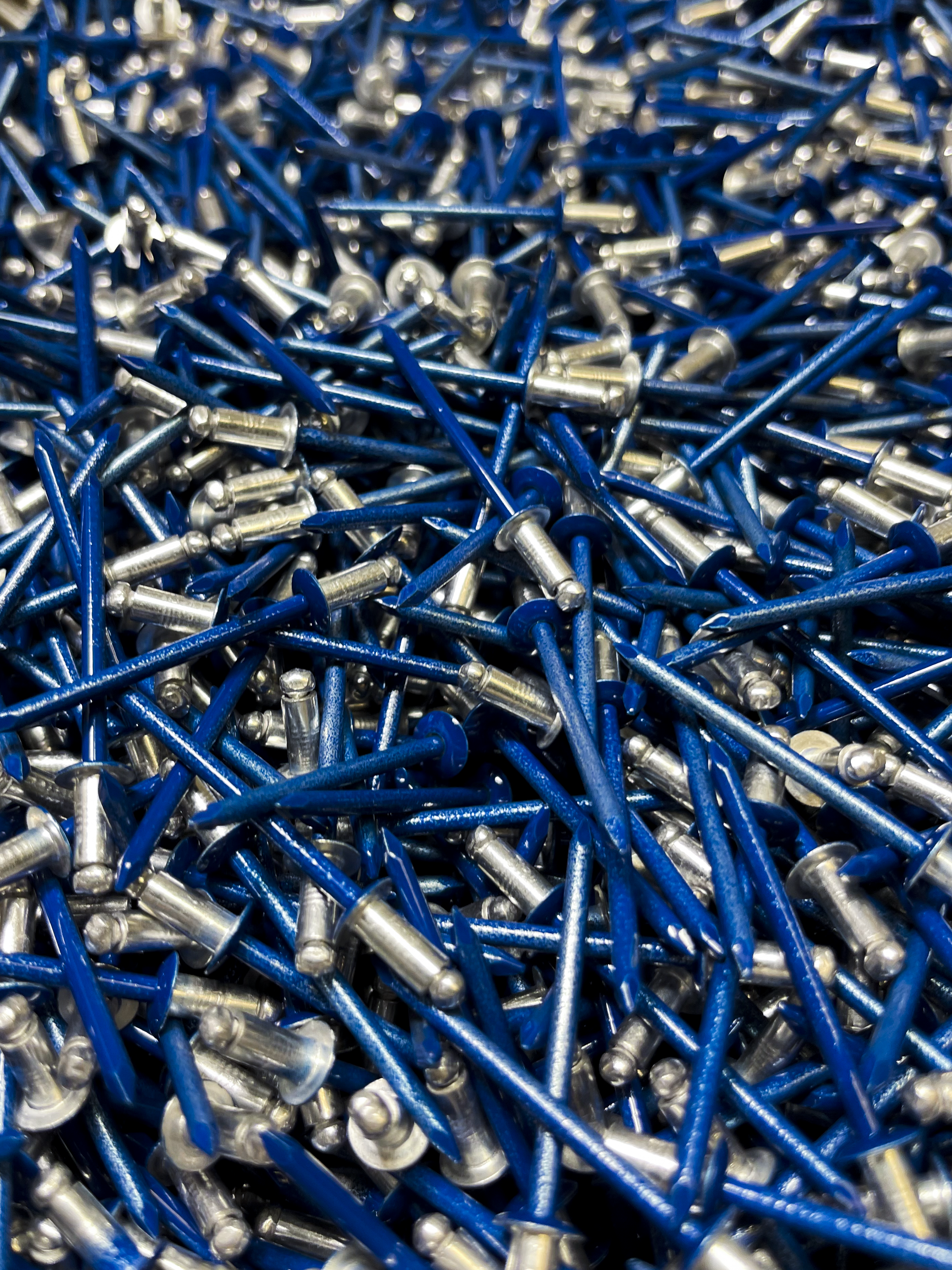 Blue spray painted rivets