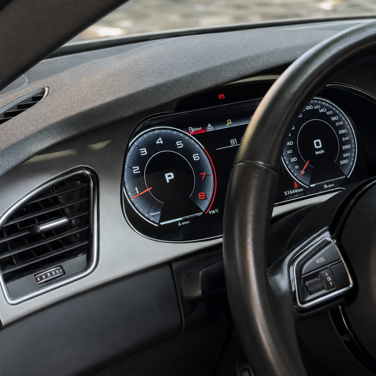 Close-up of a car dashboard displaying a speedometer, tachometer, fuel gauge, and warning lights.