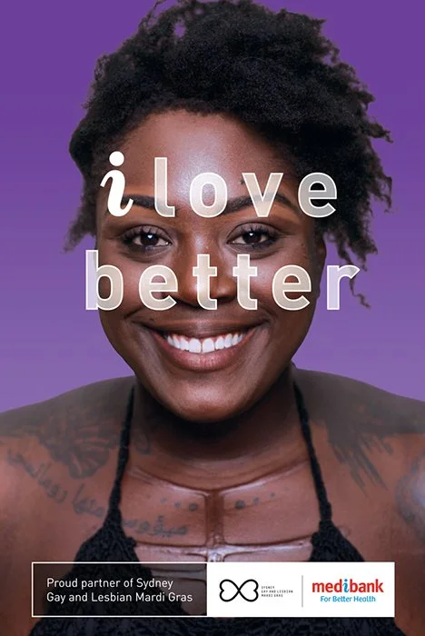 Close-up portrait of a smiling Black woman with short curly hair against a purple background, with text overlay saying 'i love better'.
