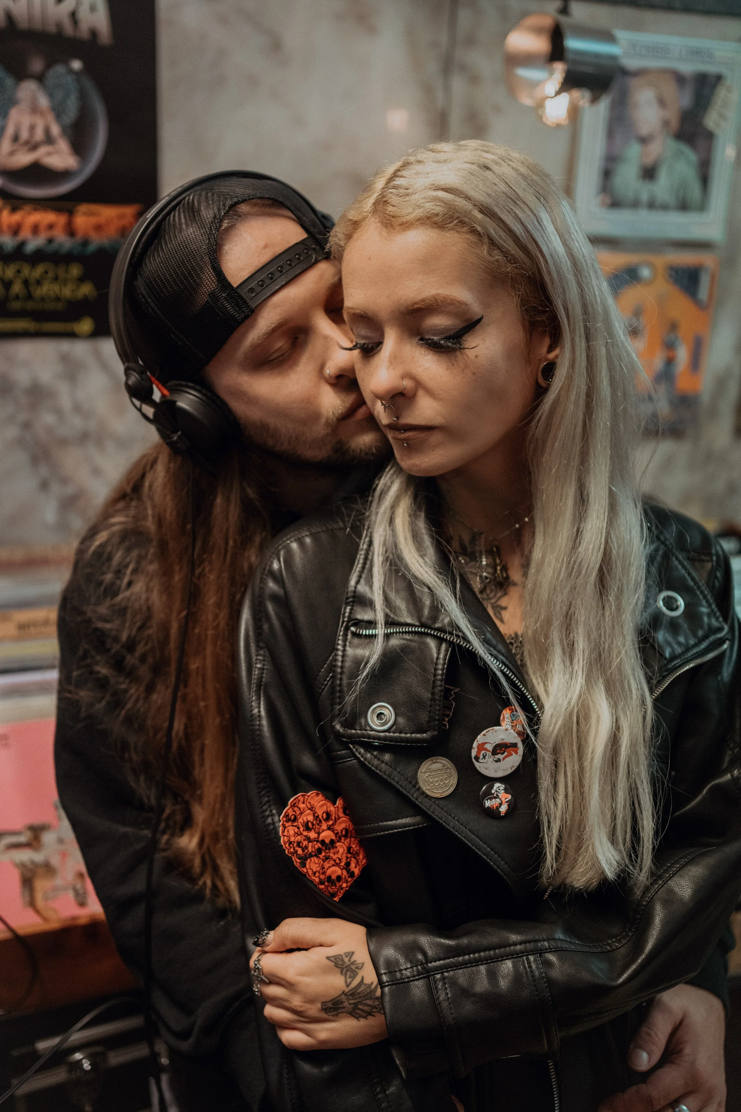 Alternative engagement photography in Lisbon, couple sharing quiet moment inside vintage record shop.