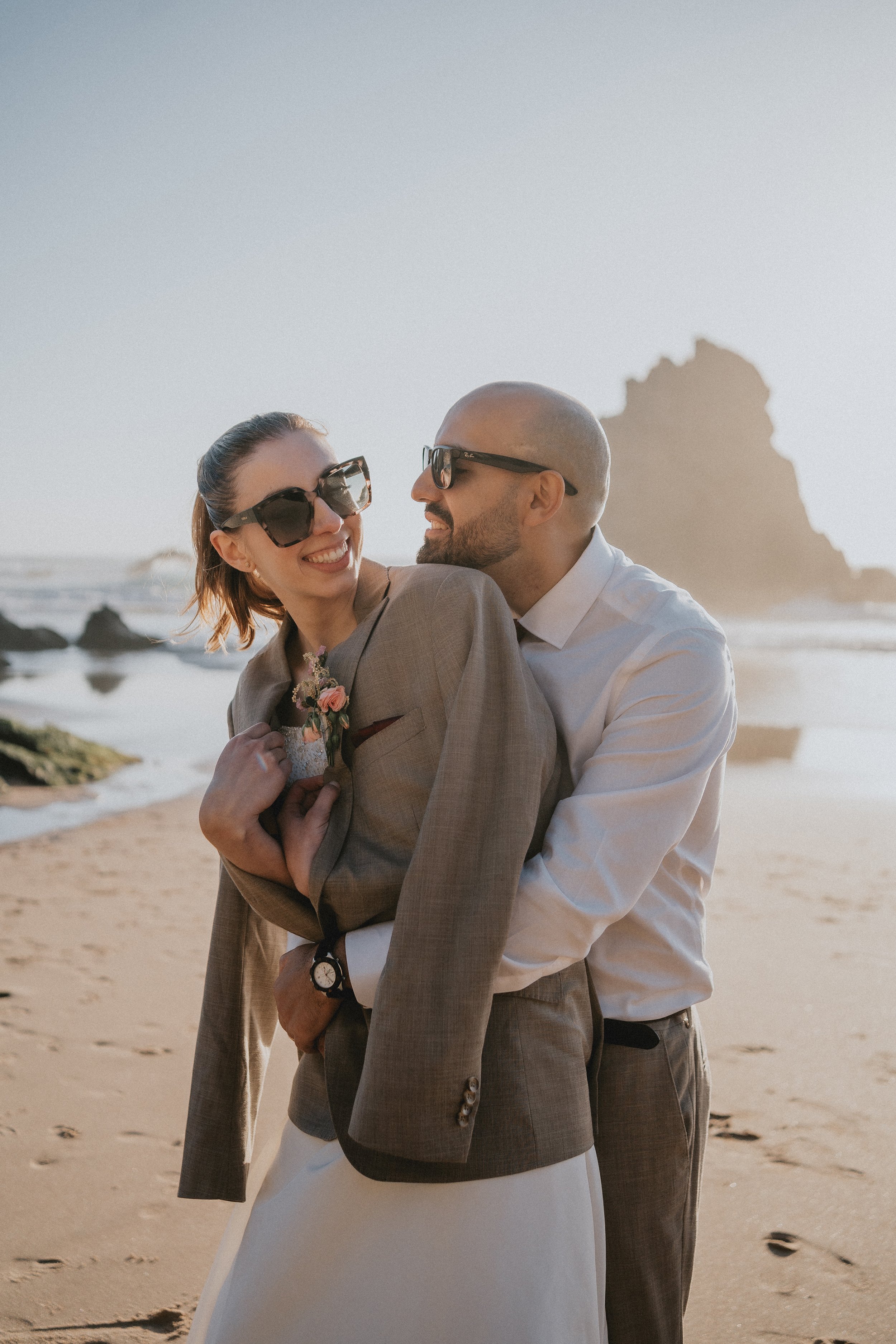 Modern couple during stylish beach elopement in Portugal