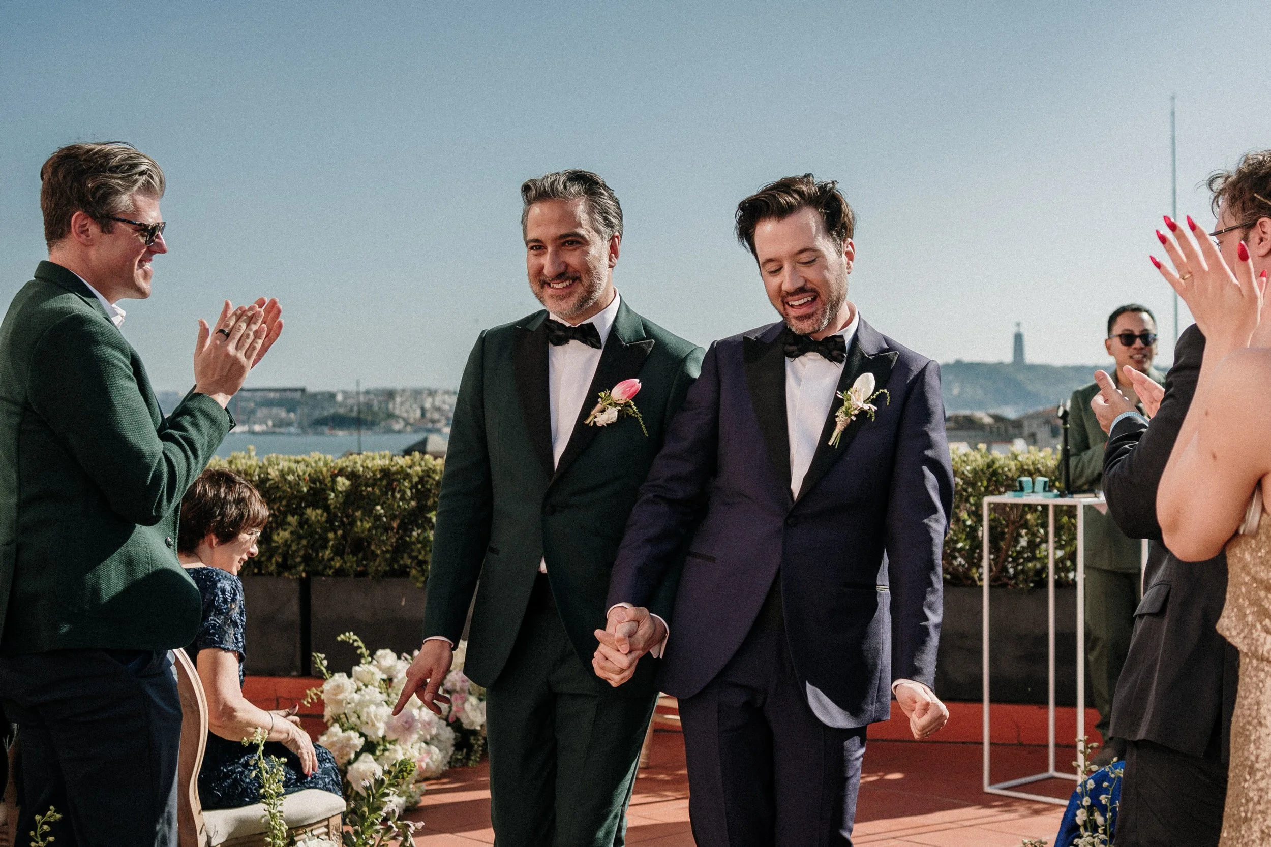 Elegant same-sex wedding portrait of two grooms during outdoor ceremony in Portugal