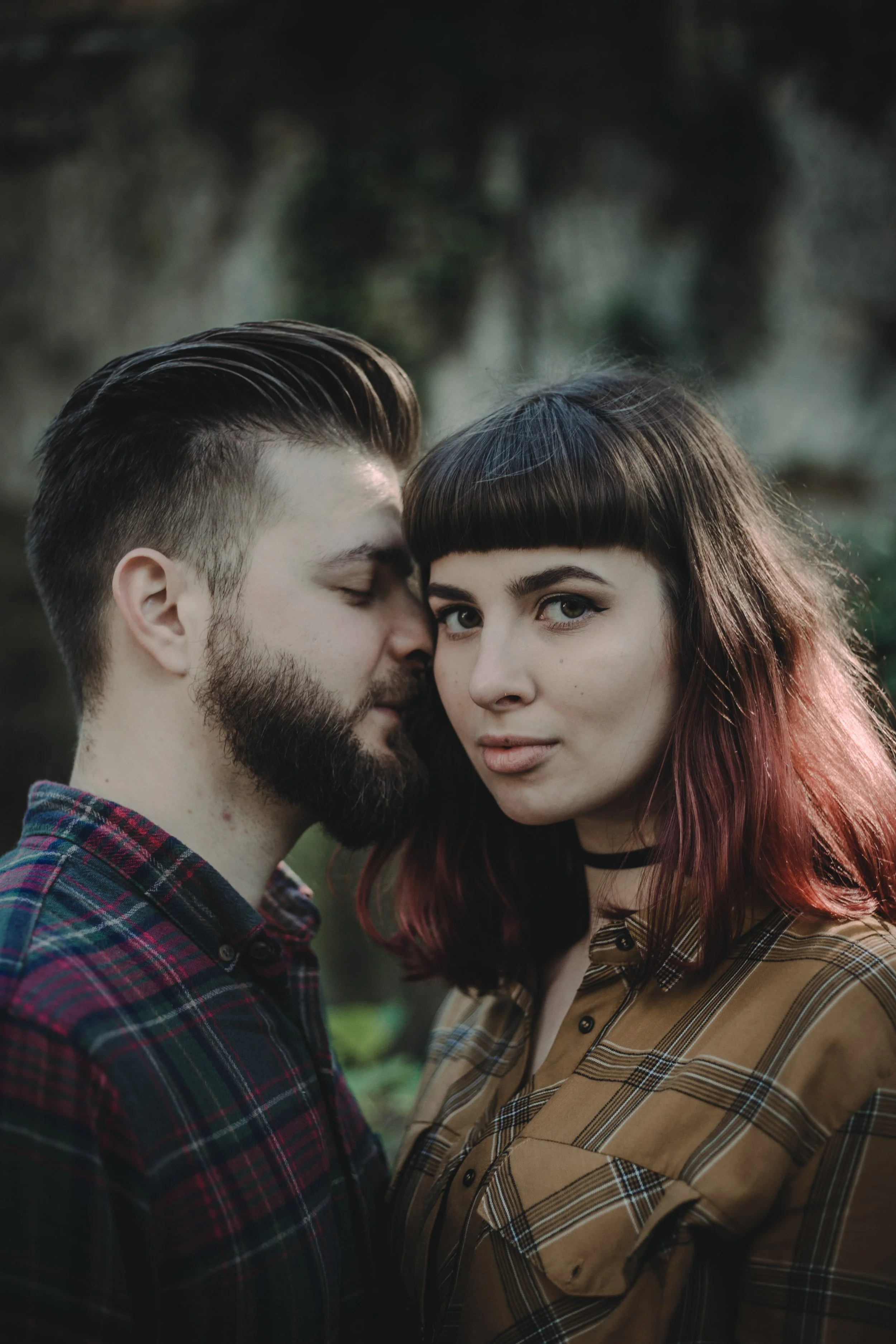 Alternative engagement photography in Lisbon, close-up portrait of couple in intimate embrace.