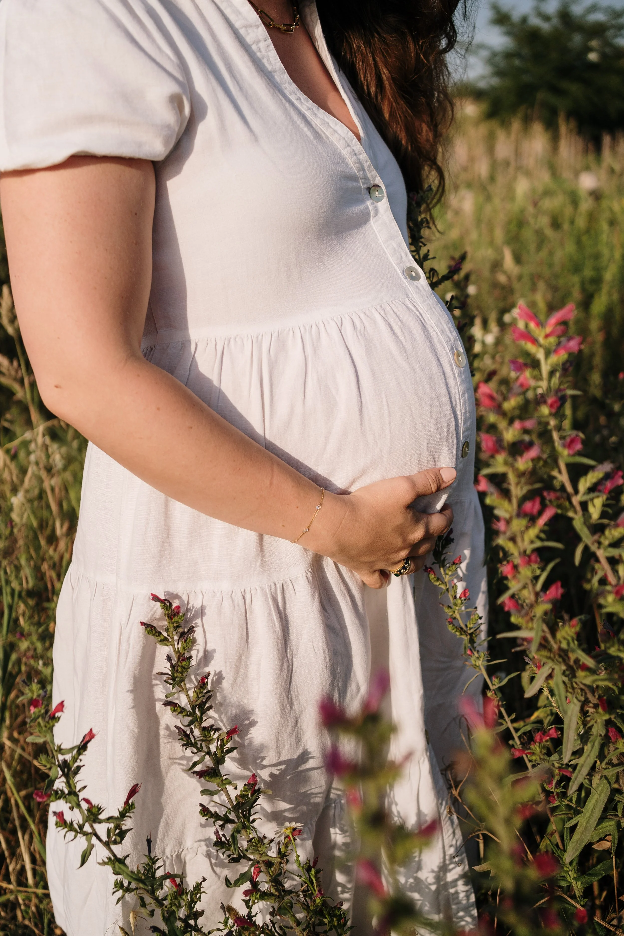 Details of a pregnant woman in nature