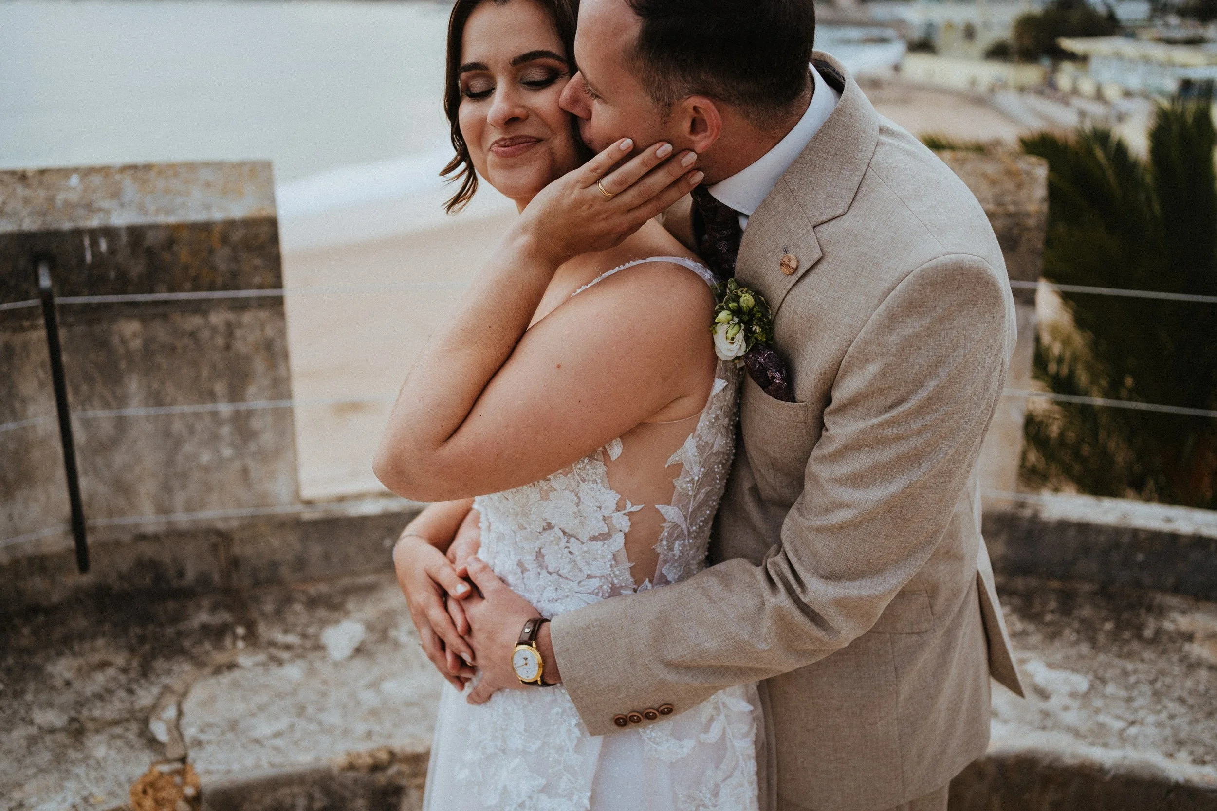 Bride and groom having a romantic moment in a destination wedding in Estoril