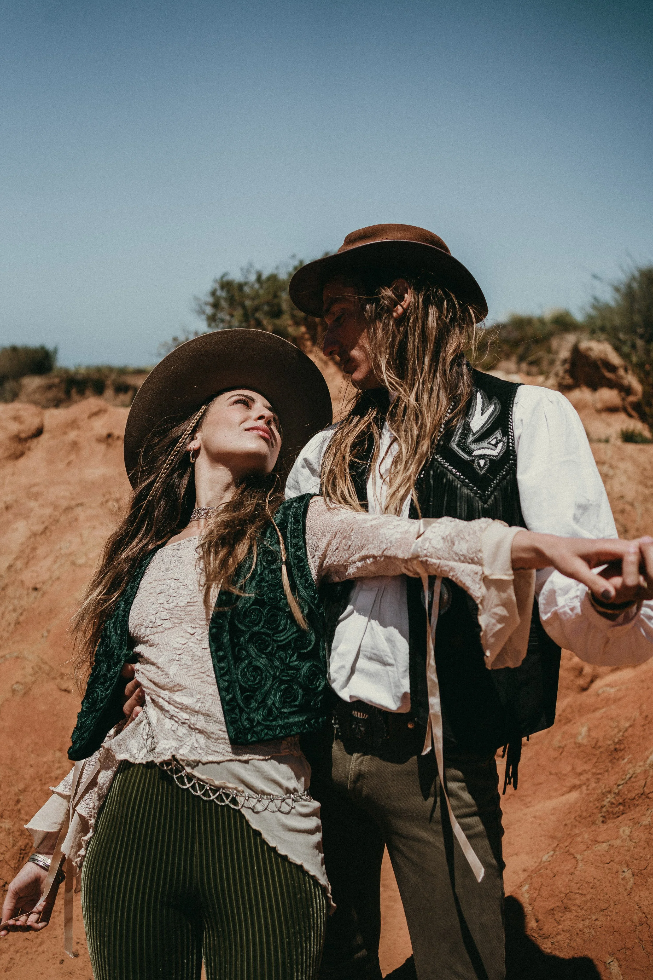 Boho bride during adventurous Portugal elopement in desert landscape