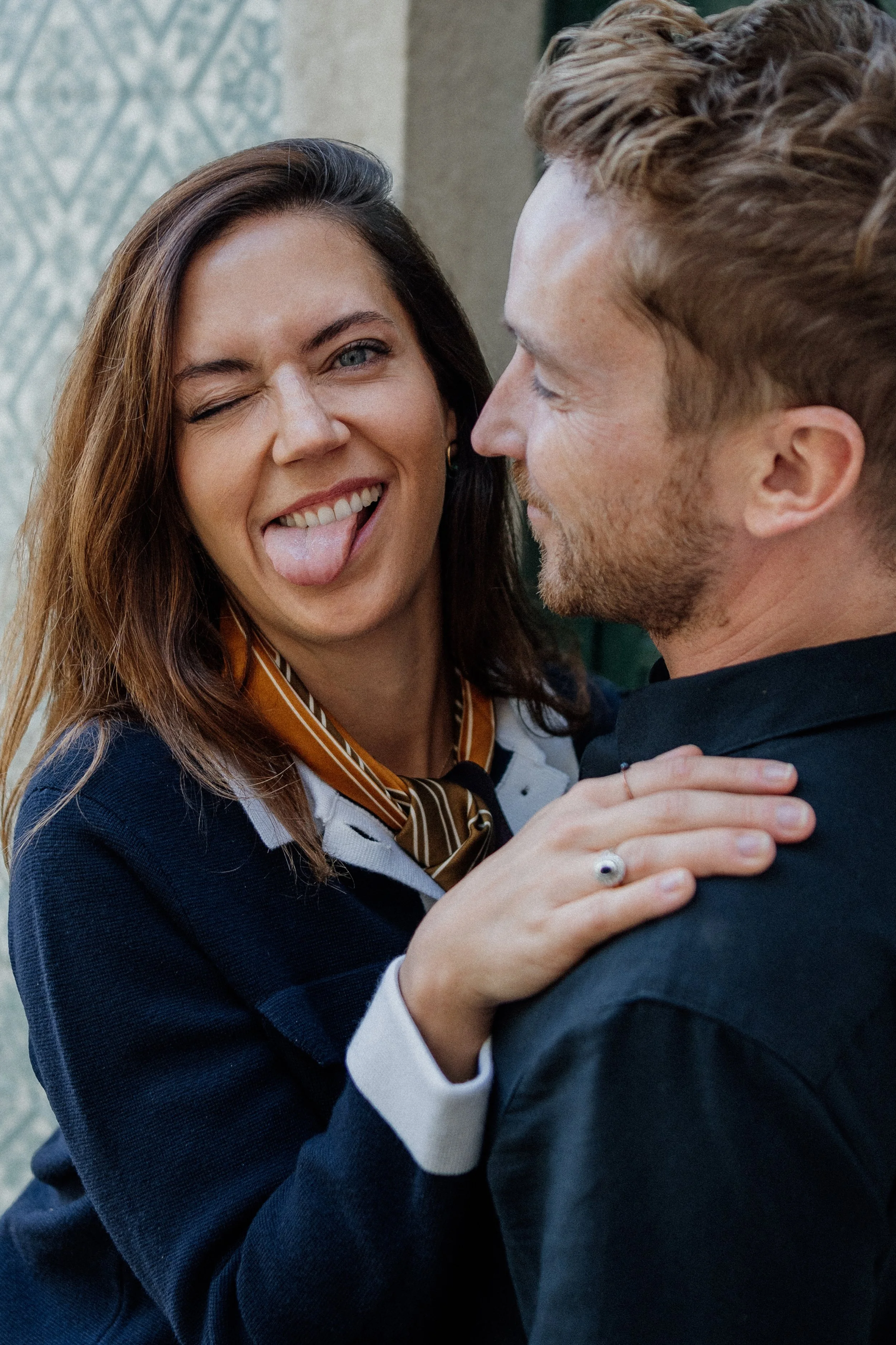Couple smilling happy in Lisbon during a photoshoot.