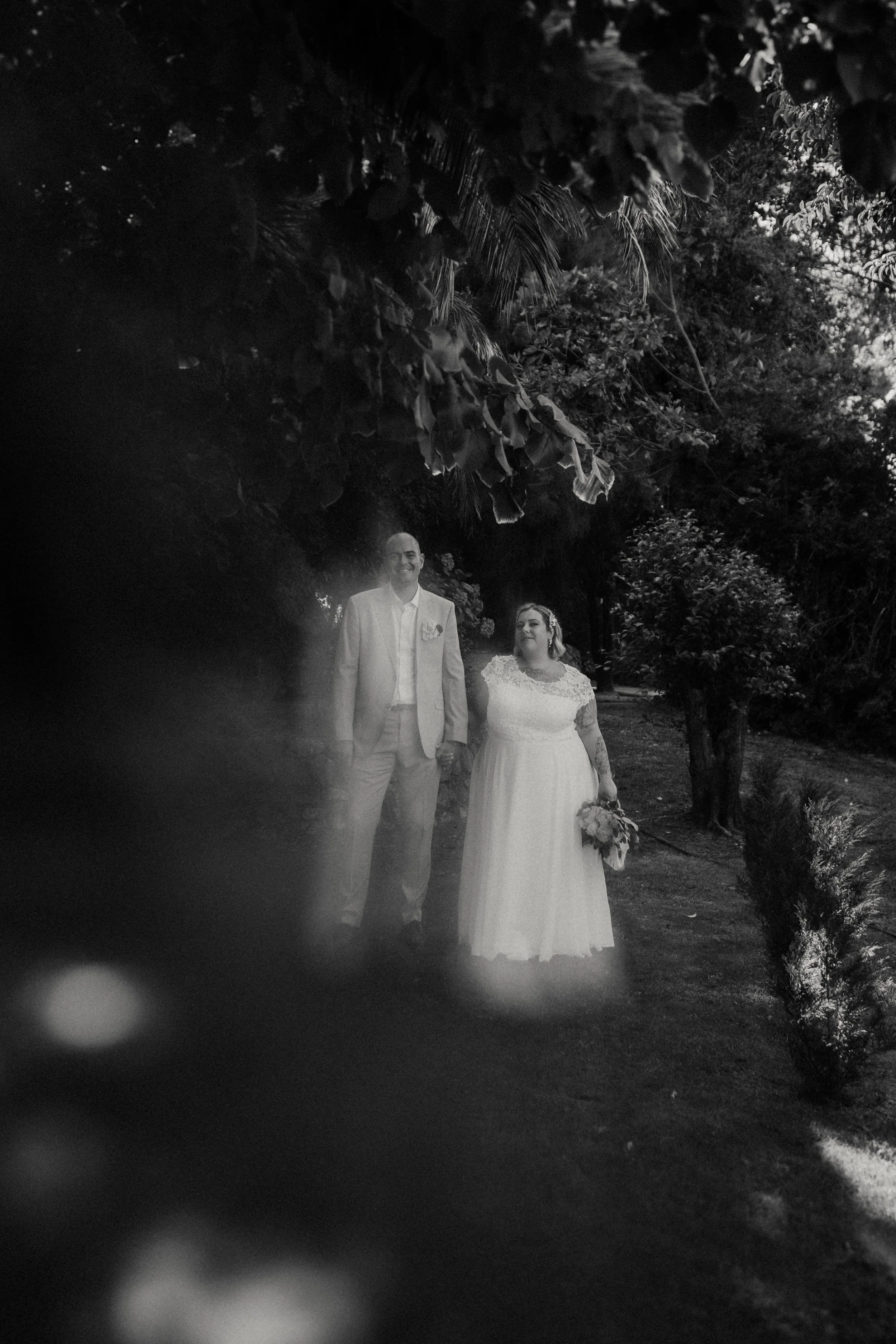 Artistic nighttime wedding photography capturing couple walking together in soft motion blur
