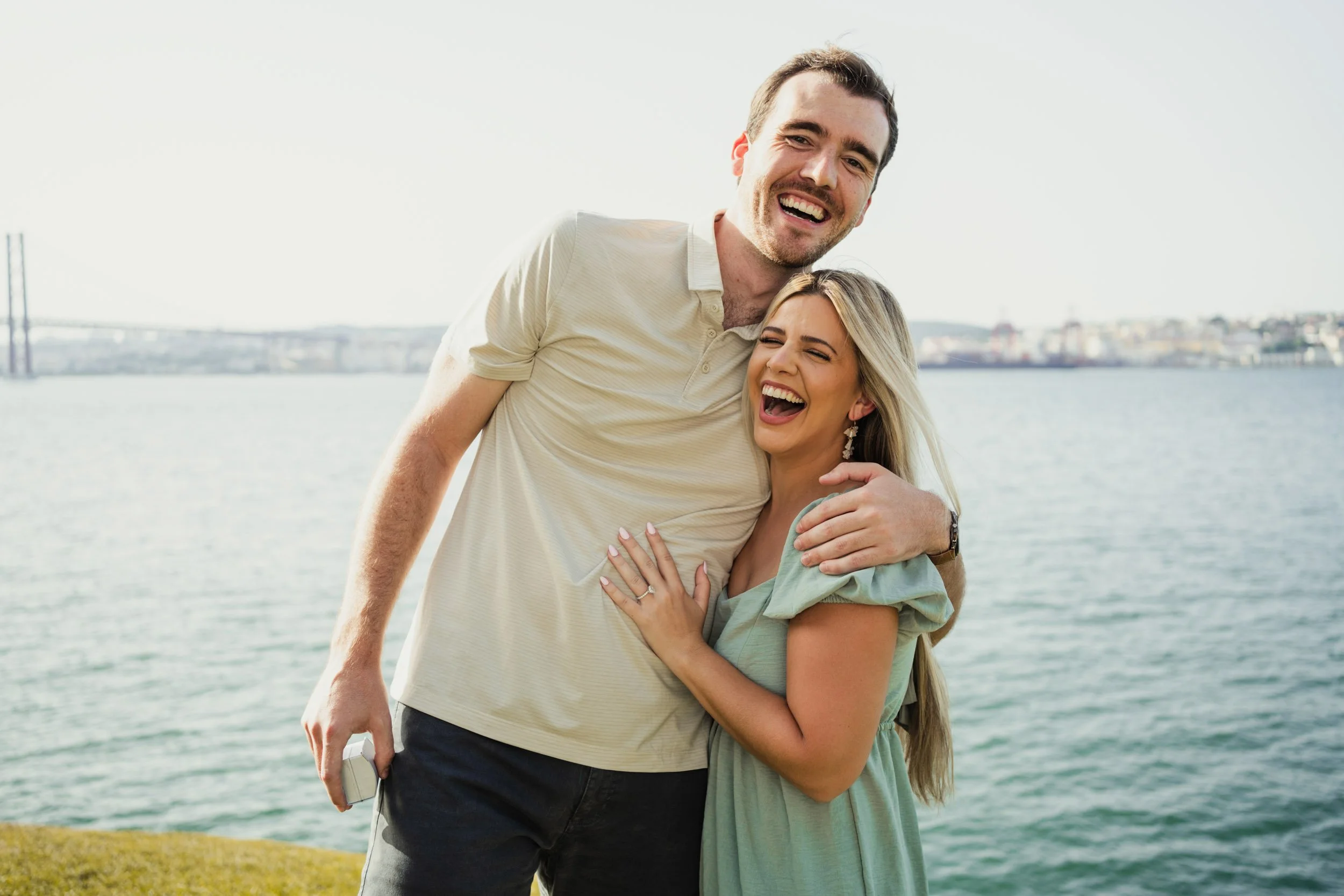 Engagement photography in Lisbon, playful couple sharing candid moment during city session.