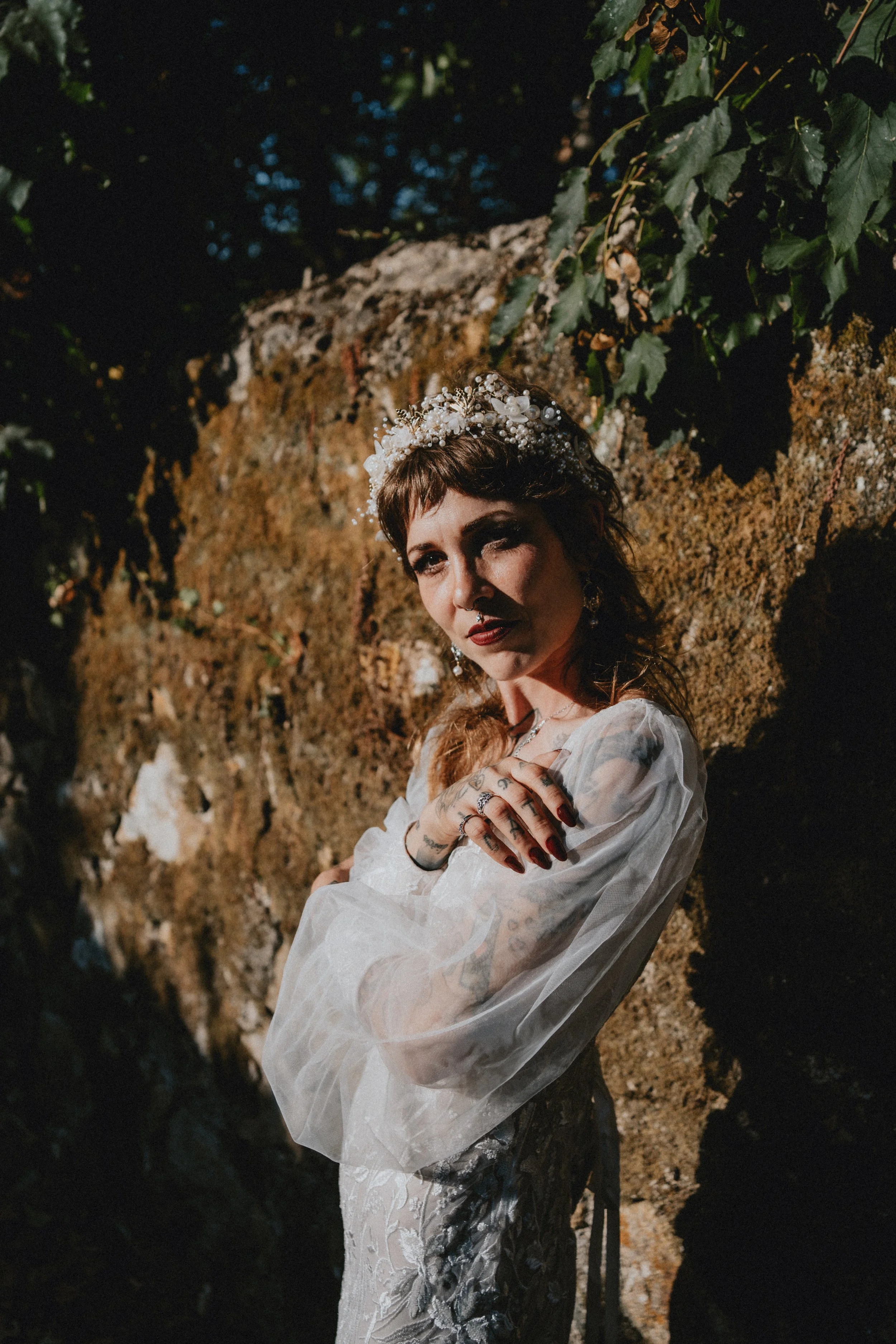 Emotional bridal portrait in warm golden hour light during destination wedding in Portugal