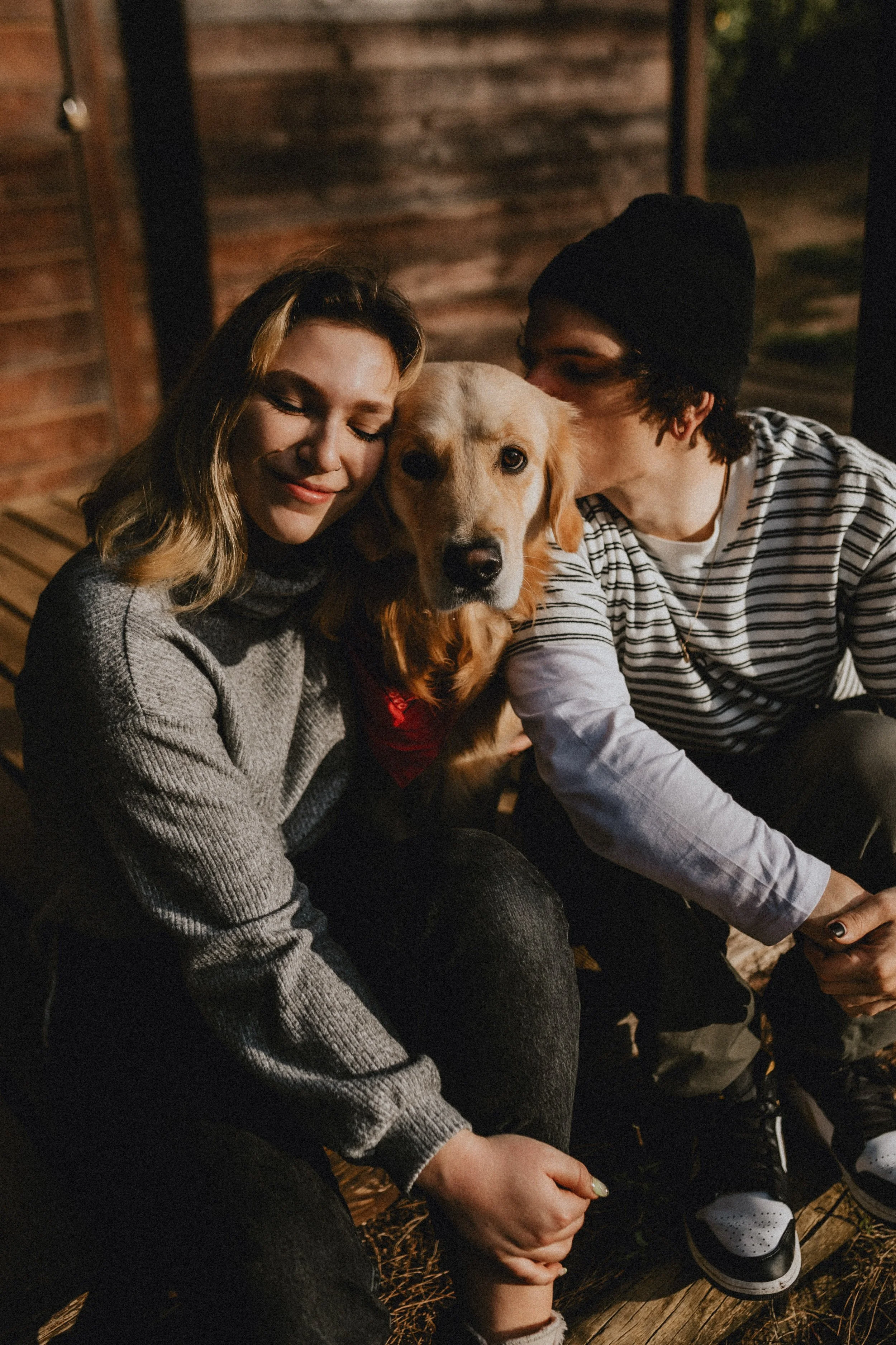Romantic engagement photography in Portugal, couple sharing quiet moment in soft natural light.
