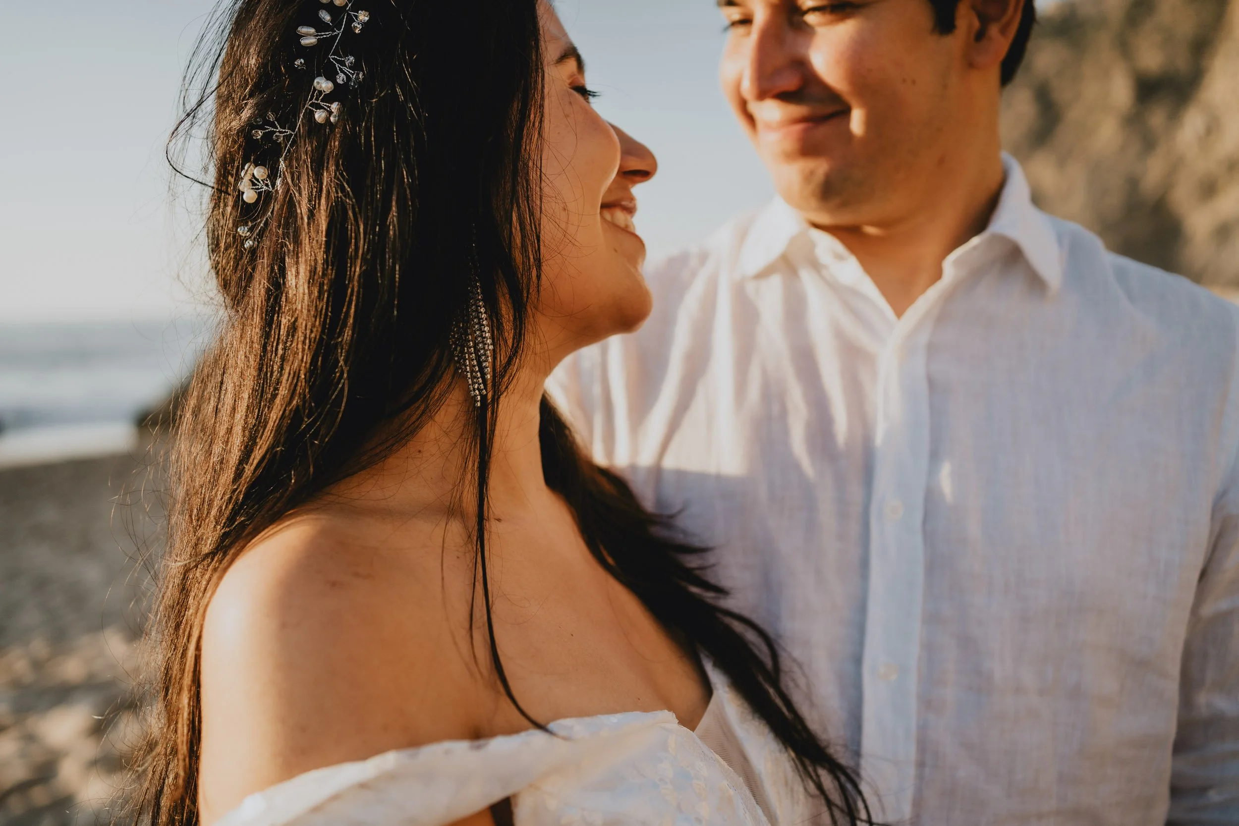 Portrait of bride and groom having their elopement in Adage beach