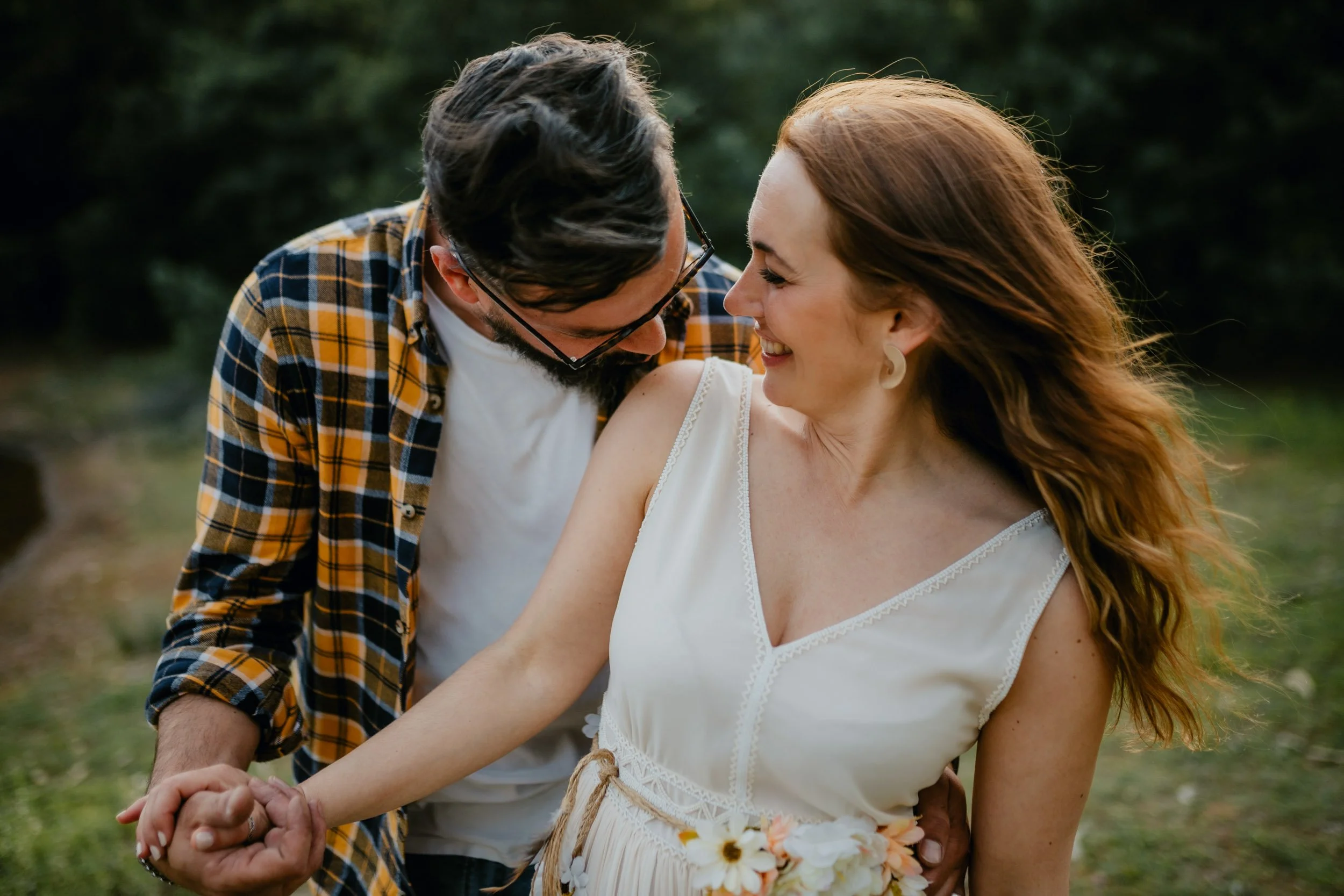 Engagement photography in Portugal, couple walking hand in hand through nature.