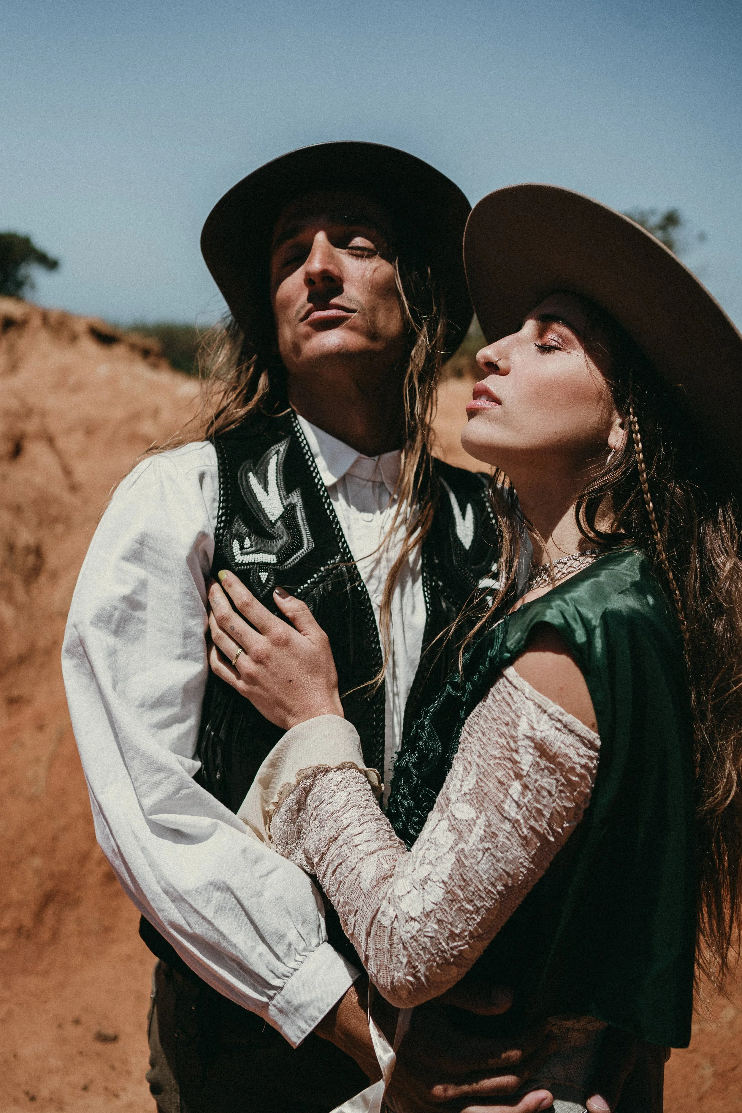 Portrait of bride and groom looking at the sun during their elopement in Ericeira