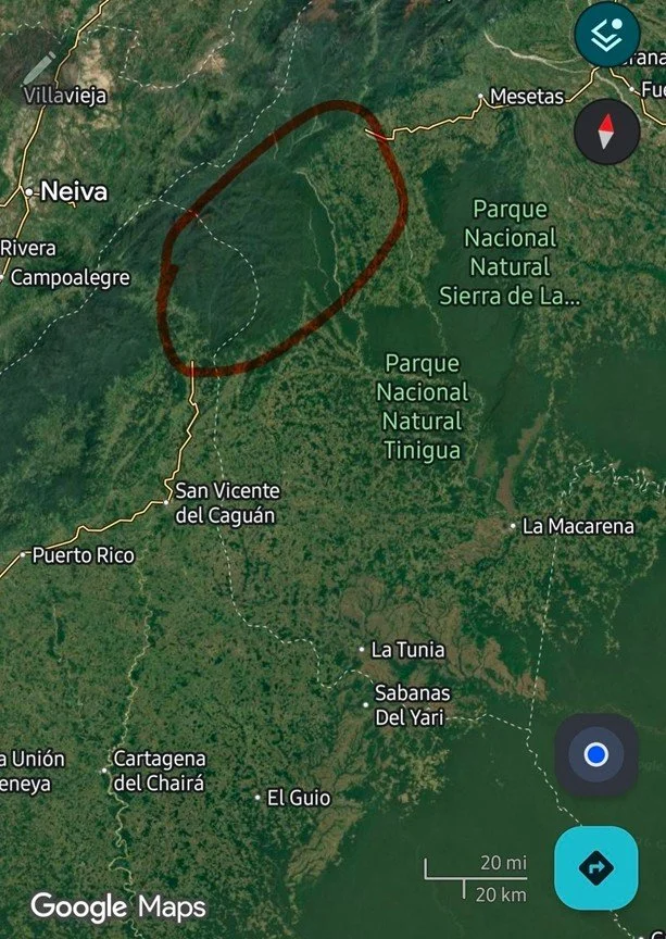 Map showing a region in Colombia with natural parks, towns, and roads. A red circle highlights a specific area in the northern part of the map.