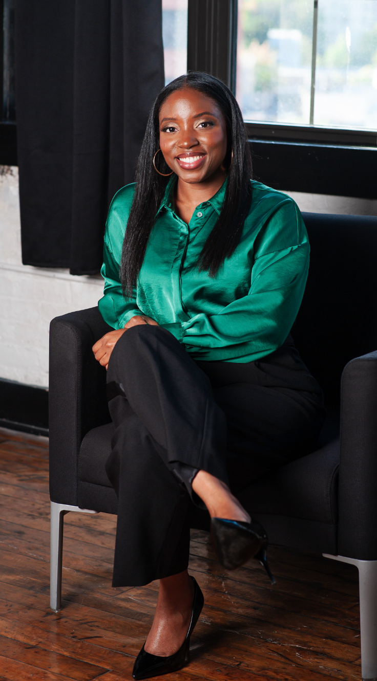The Performance Pivot LLC Founder and leadership development consultant Quinelle Hickman smiling.