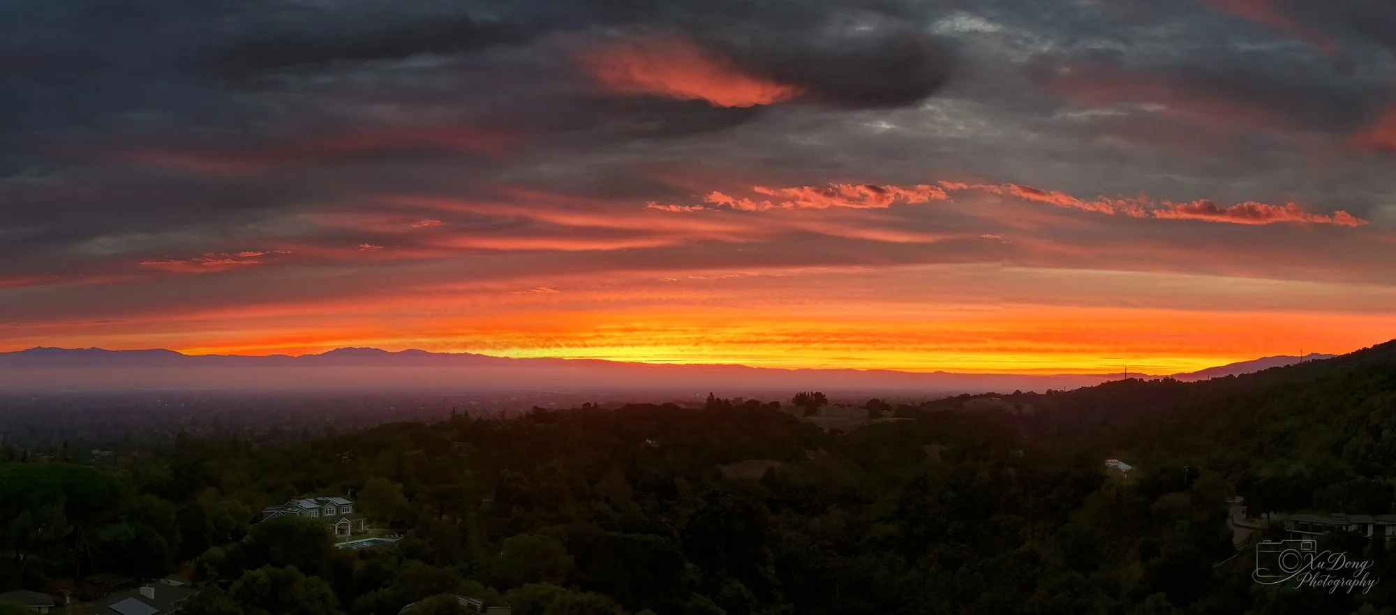 Aerial bird's-eye view of sunrise over the South Bay.