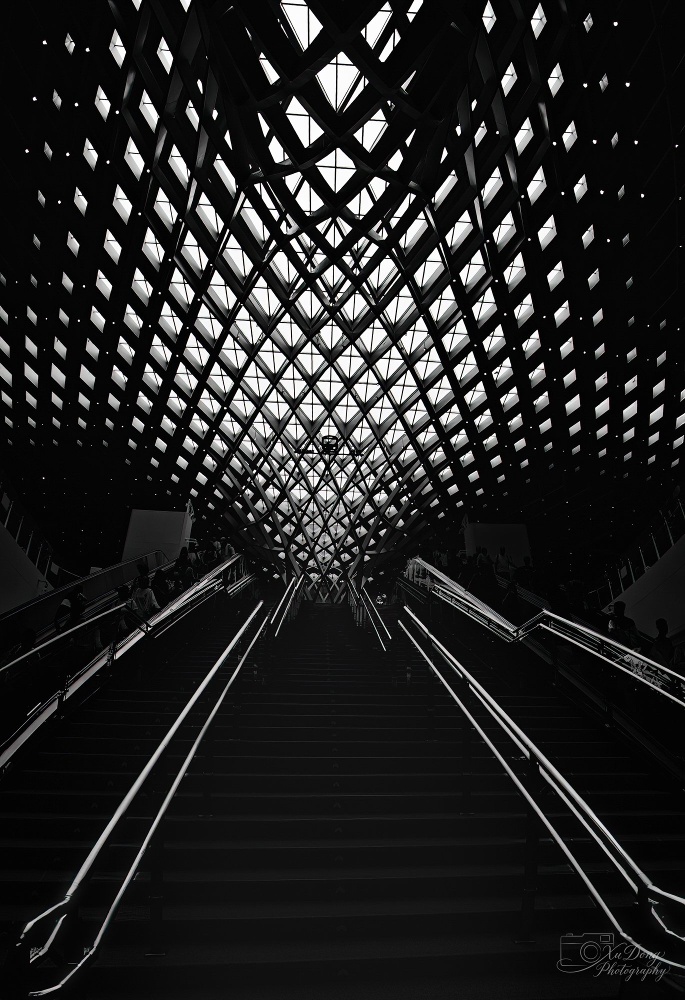 Symmetrical architectural geometry inside the modern Beijing ChaoYang train station, highlighting the city’s rapid transit expansion