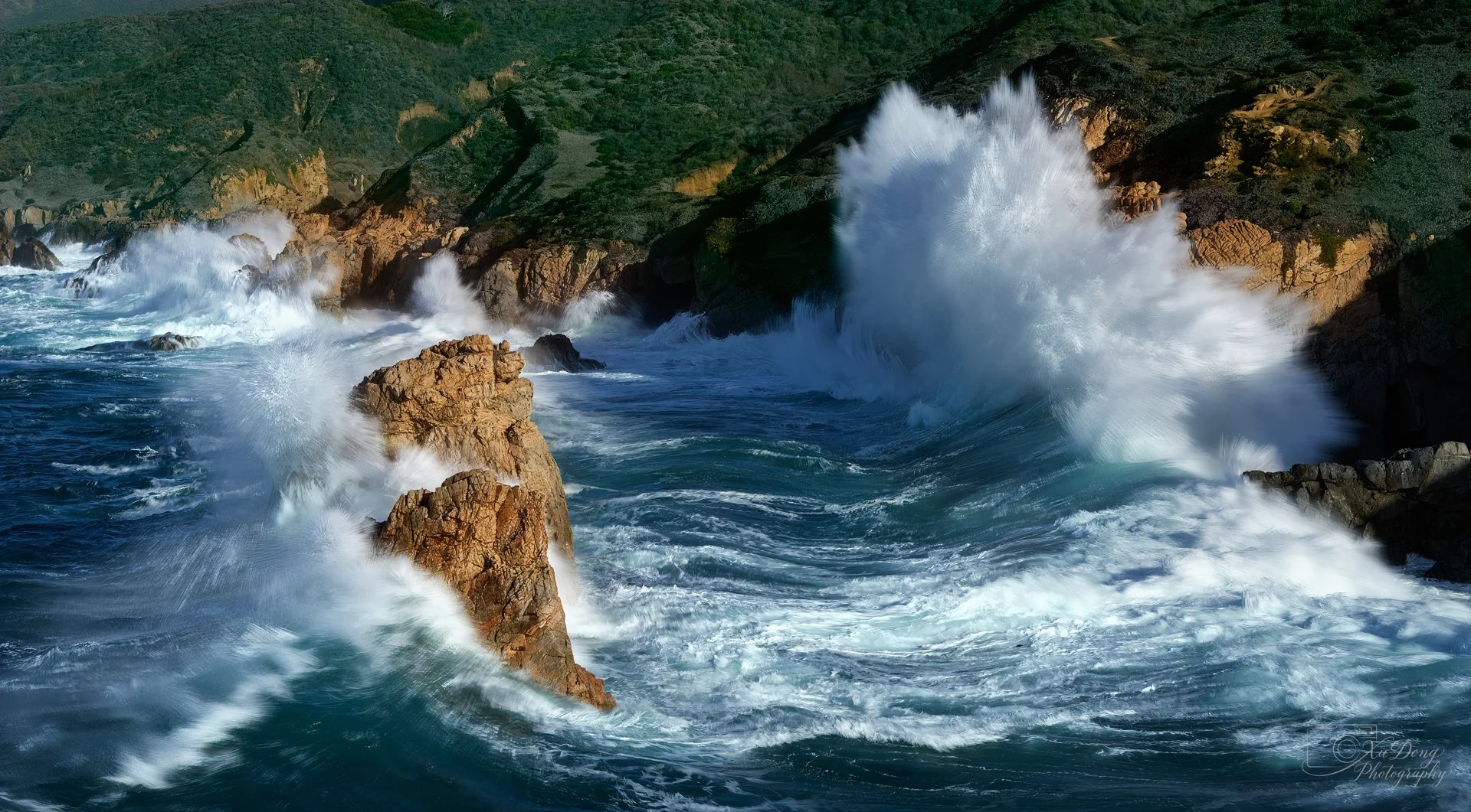 High-speed coastal photography capturing the raw, explosive power of a massive breaking wave.