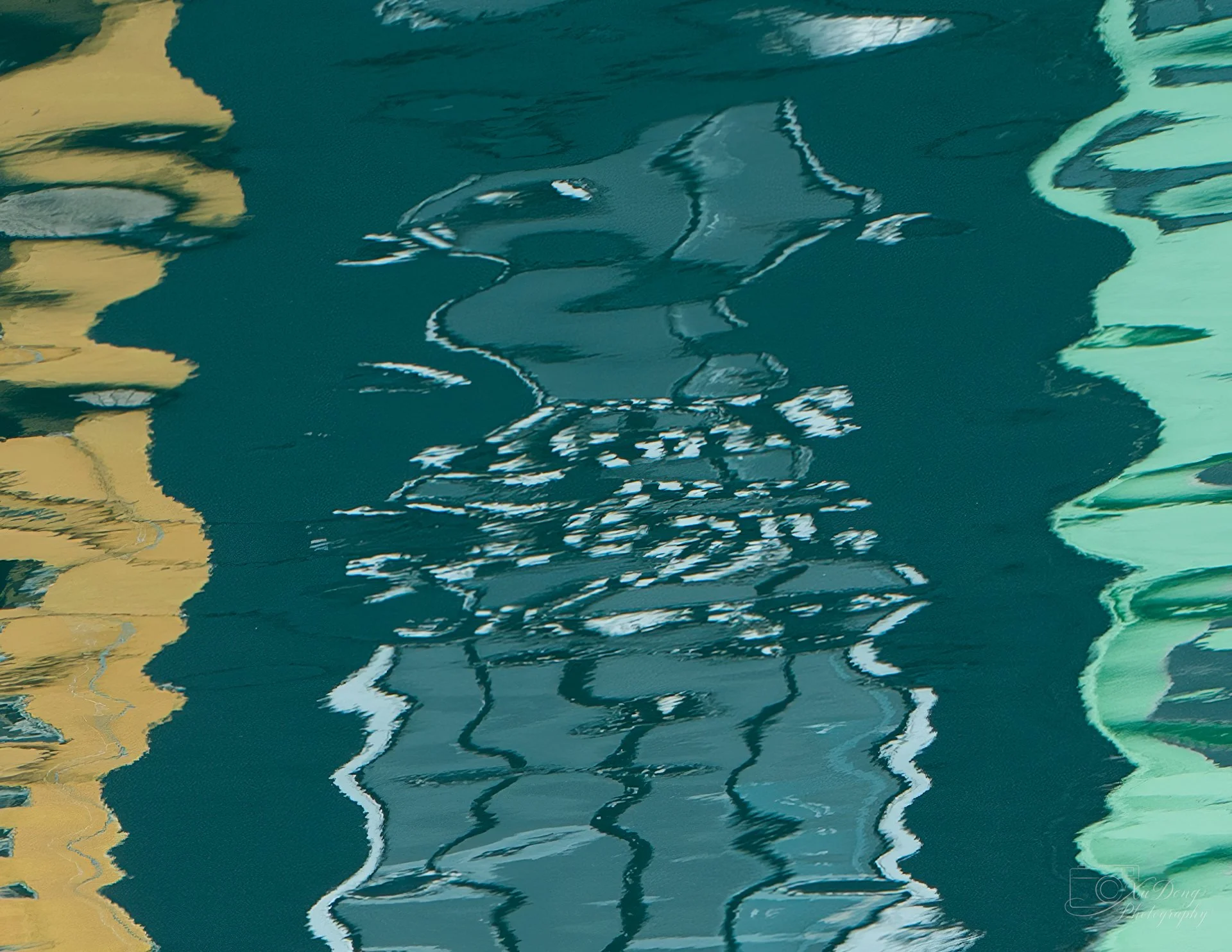 Abstract water reflection photography from a harbor in Taiwan; capturing rhythmic light, color, and fluid textures.