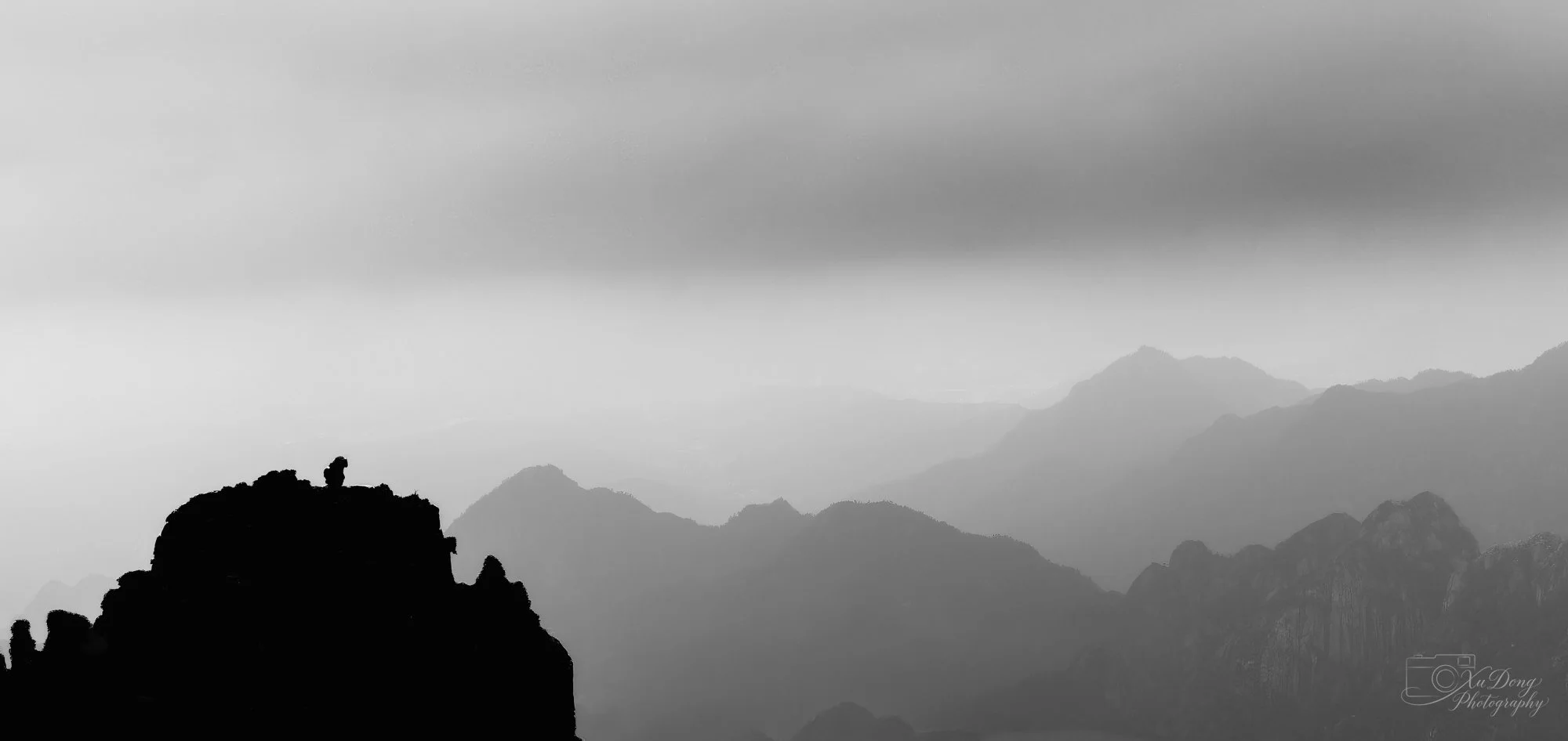 The iconic "Stone Monkey Watching the Sea of Clouds" at Huangshan, a legendary peak formation steeped in myth and history