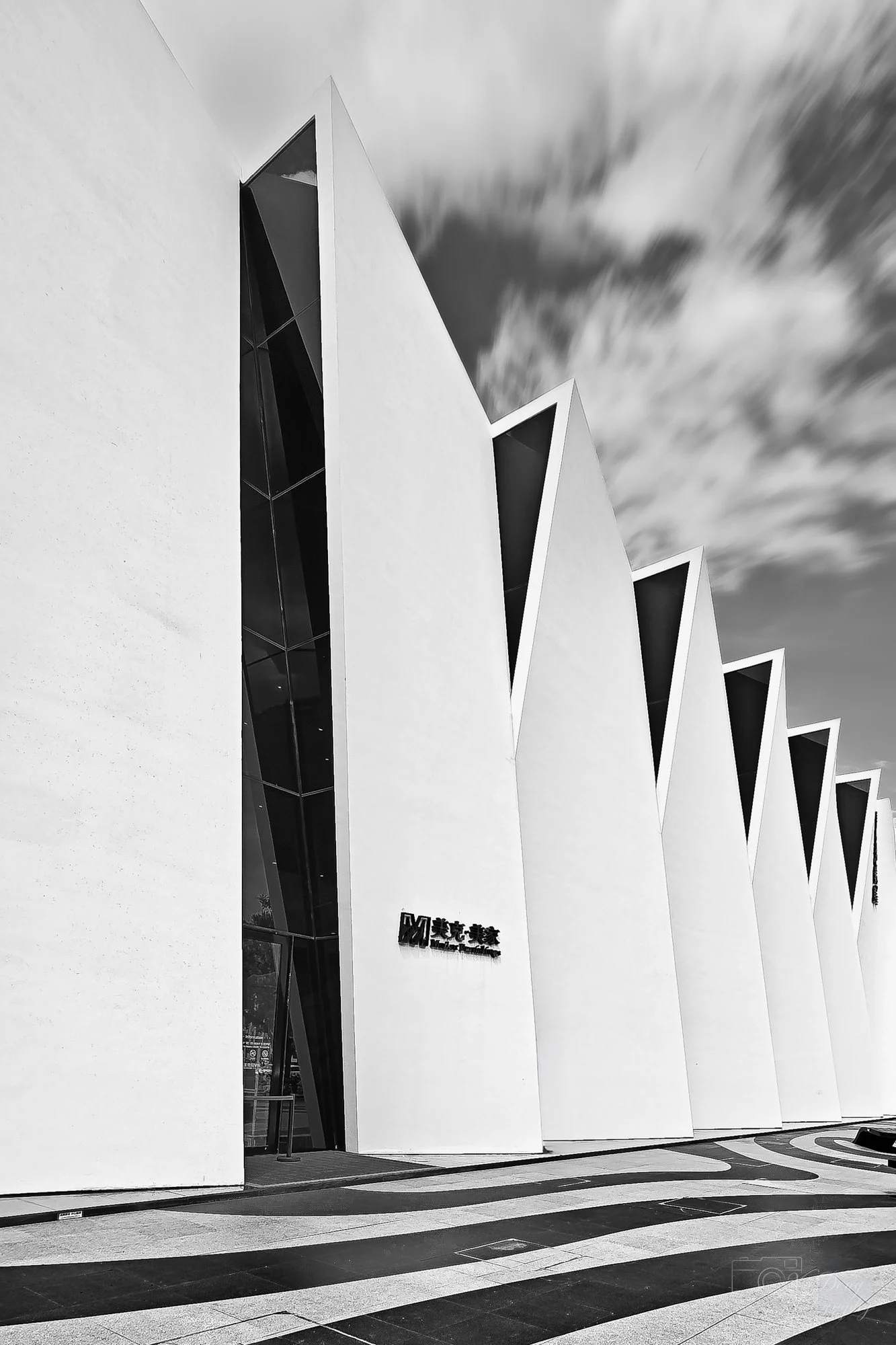 An abstract study of a modern "sawtooth" building in Beijing, emphasizing sharp, angular architectural lines.