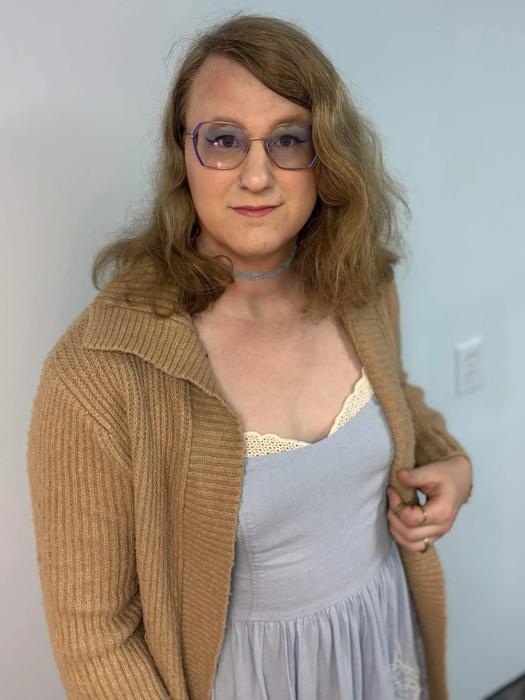 Nigel Turk, a genderfluid mental health therapist, presenting as feminine