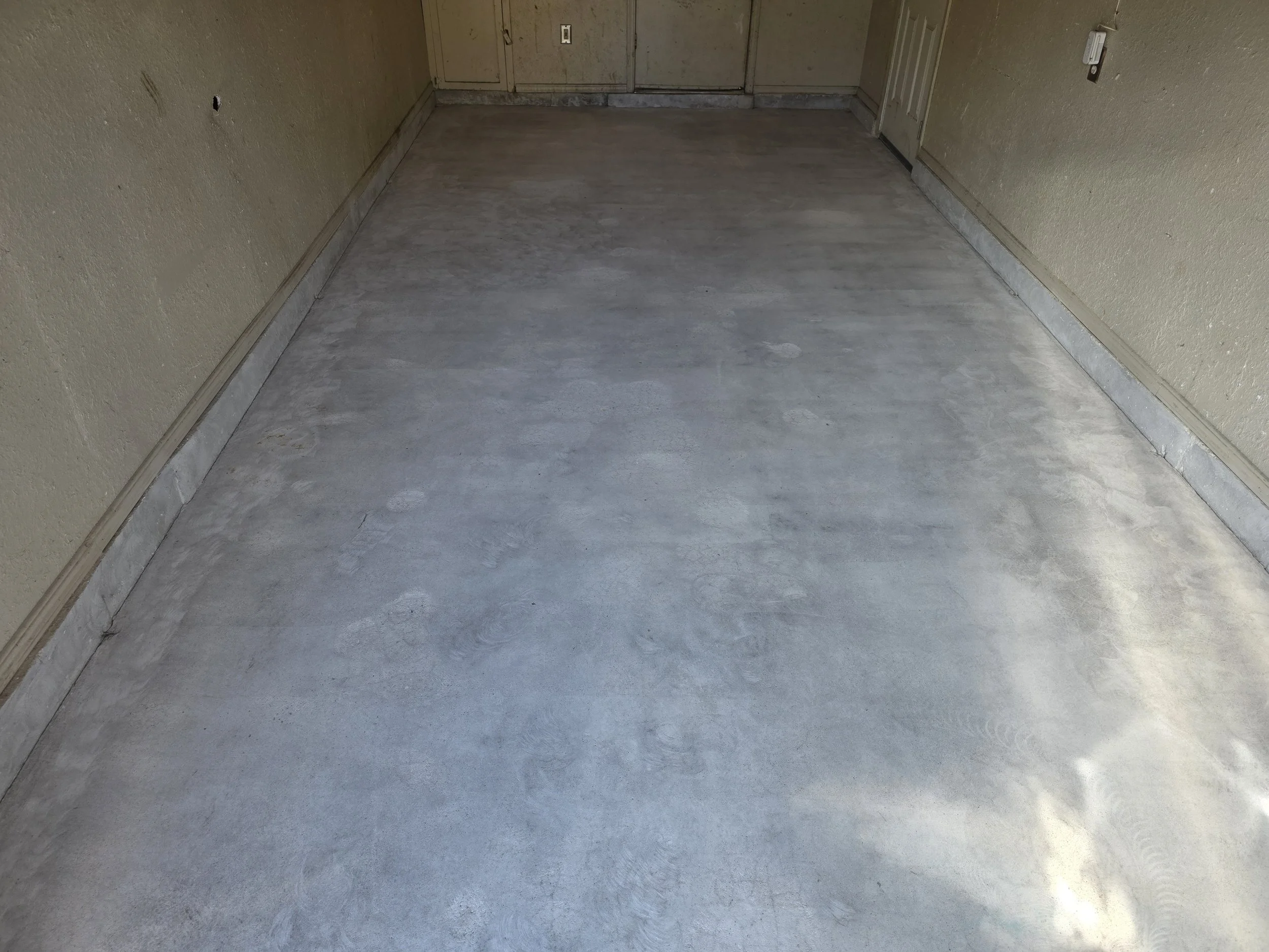 Surface prep complete. The slab has been diamond ground, opening the concrete's pores for maximum adhesion. 