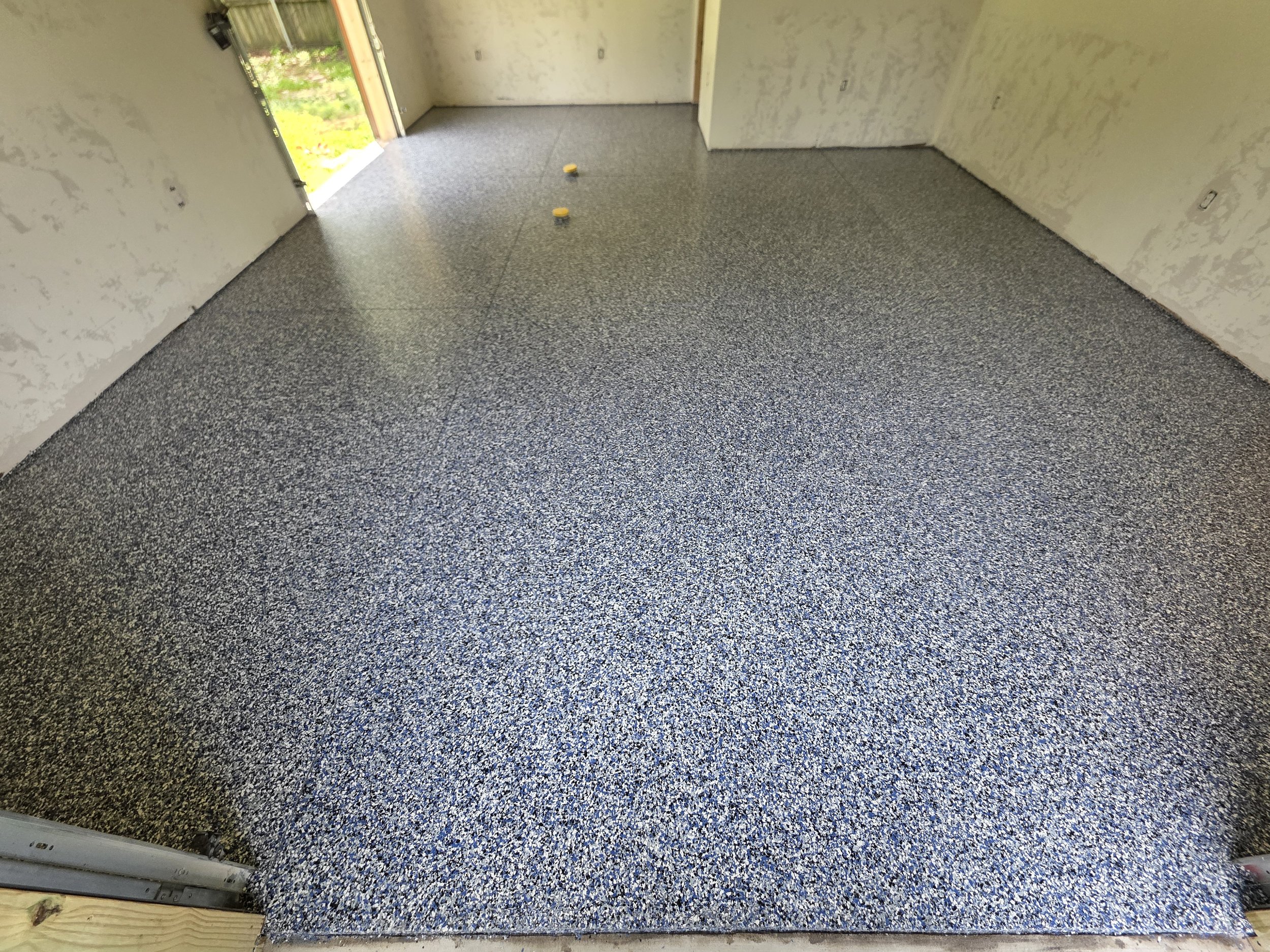 3 - Scraping the flakes is a critical step that is completed prior to laying out the topcoat. This process removes sharp and jagged edges that could poke through the topcoat.