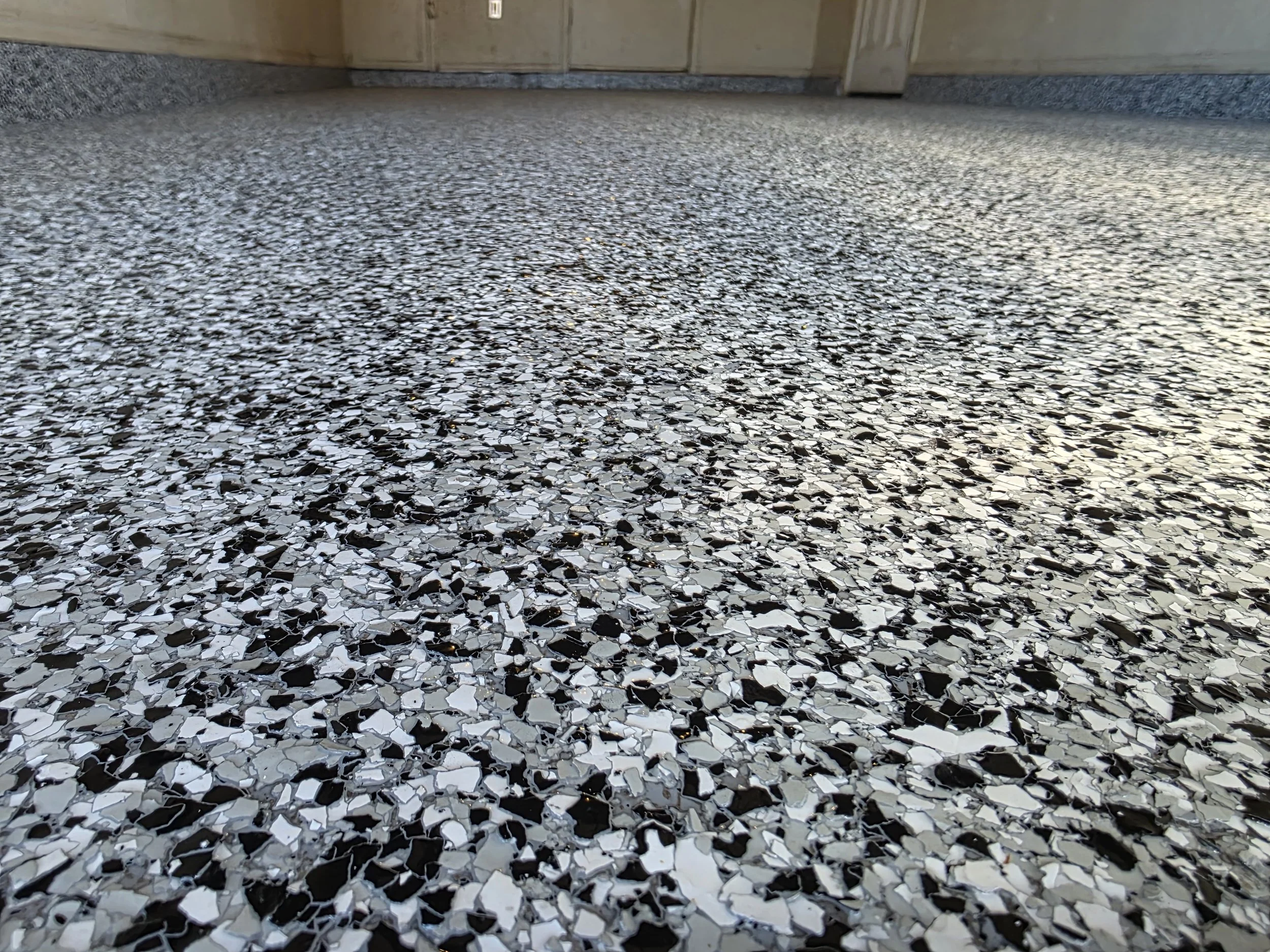 Close-up of the finished Domino flake — bold contrast, tight pattern, and a surface that's as durable as it looks.