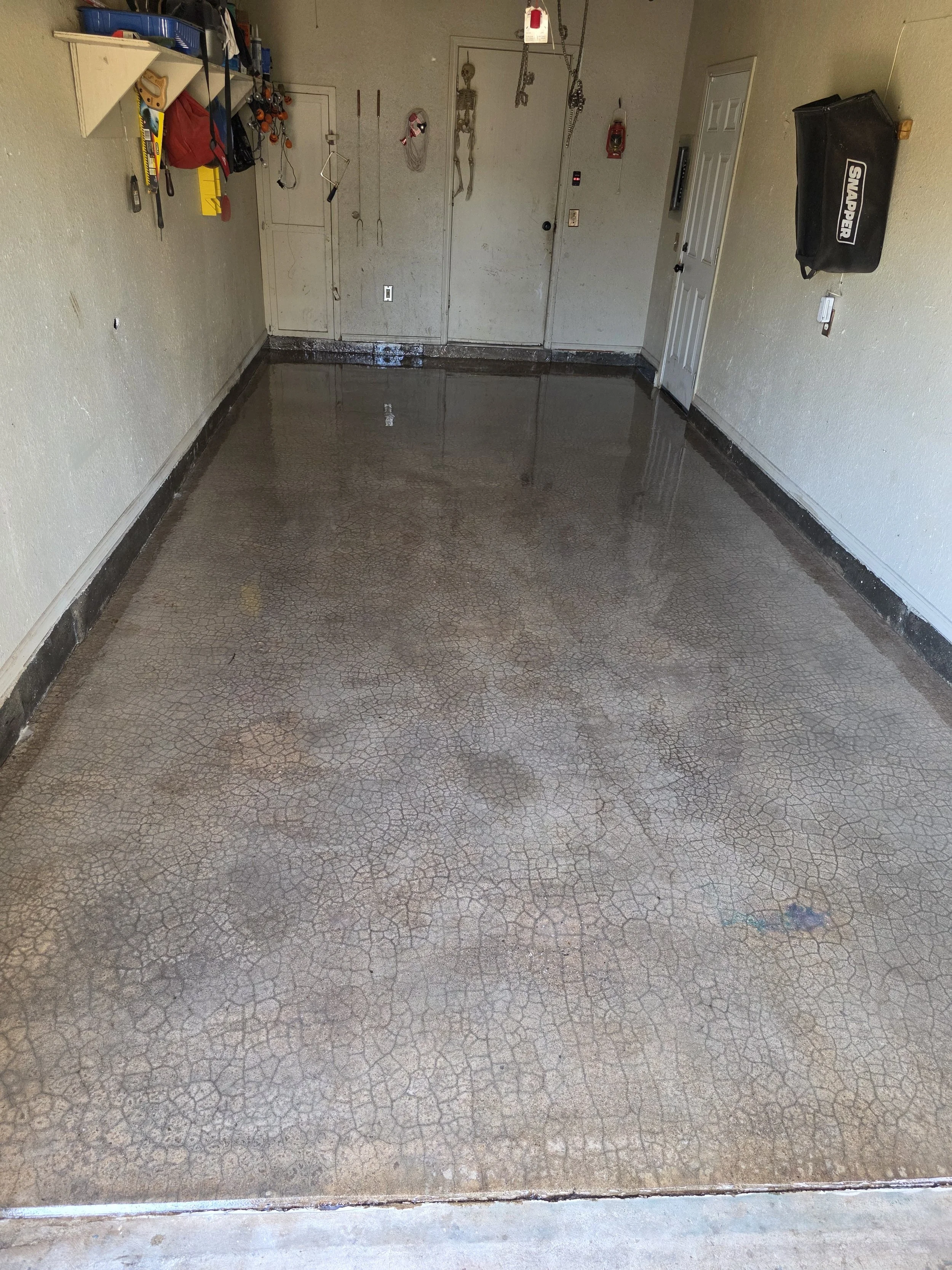 Moisture vapor barrier fully installed across the entire slab. This critical layer blocks moisture from migrating up through the concrete and compromising the system above it.