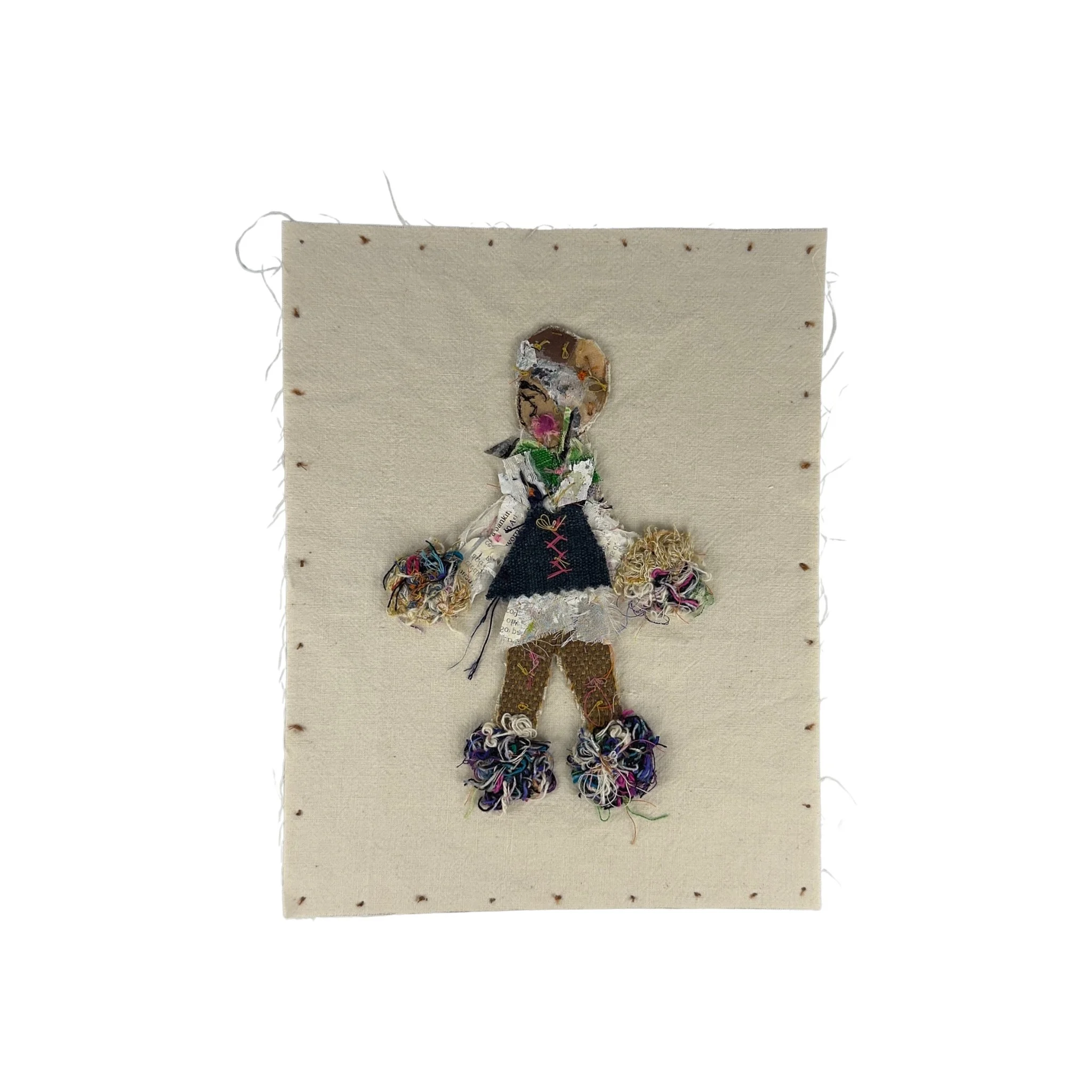 Mixed-media textile figure titled Pom-Poms by Evangelina Roa, created through layered fabric, thread scraps, embroidery thread, paper, and hand stitching.