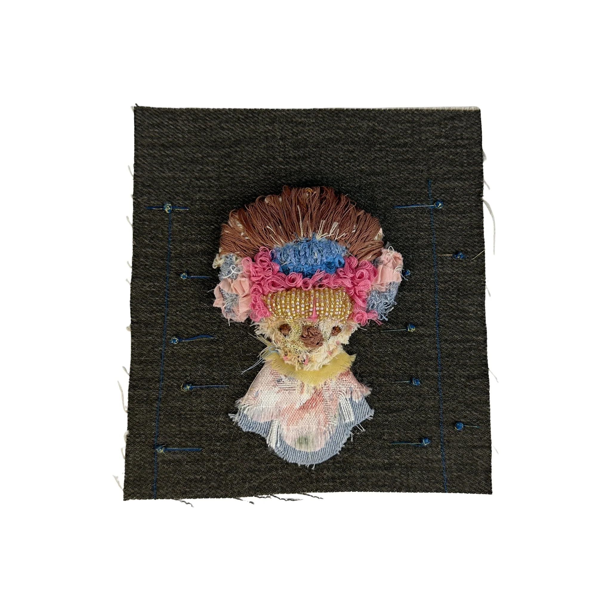 Mixed-media textile artwork titled Hair Sloth by Evangelina Roa, featuring a solitary figure created with fabric scraps, thread scraps, seed beads, and stitching.