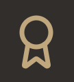 A light brown award ribbon icon on a dark background
