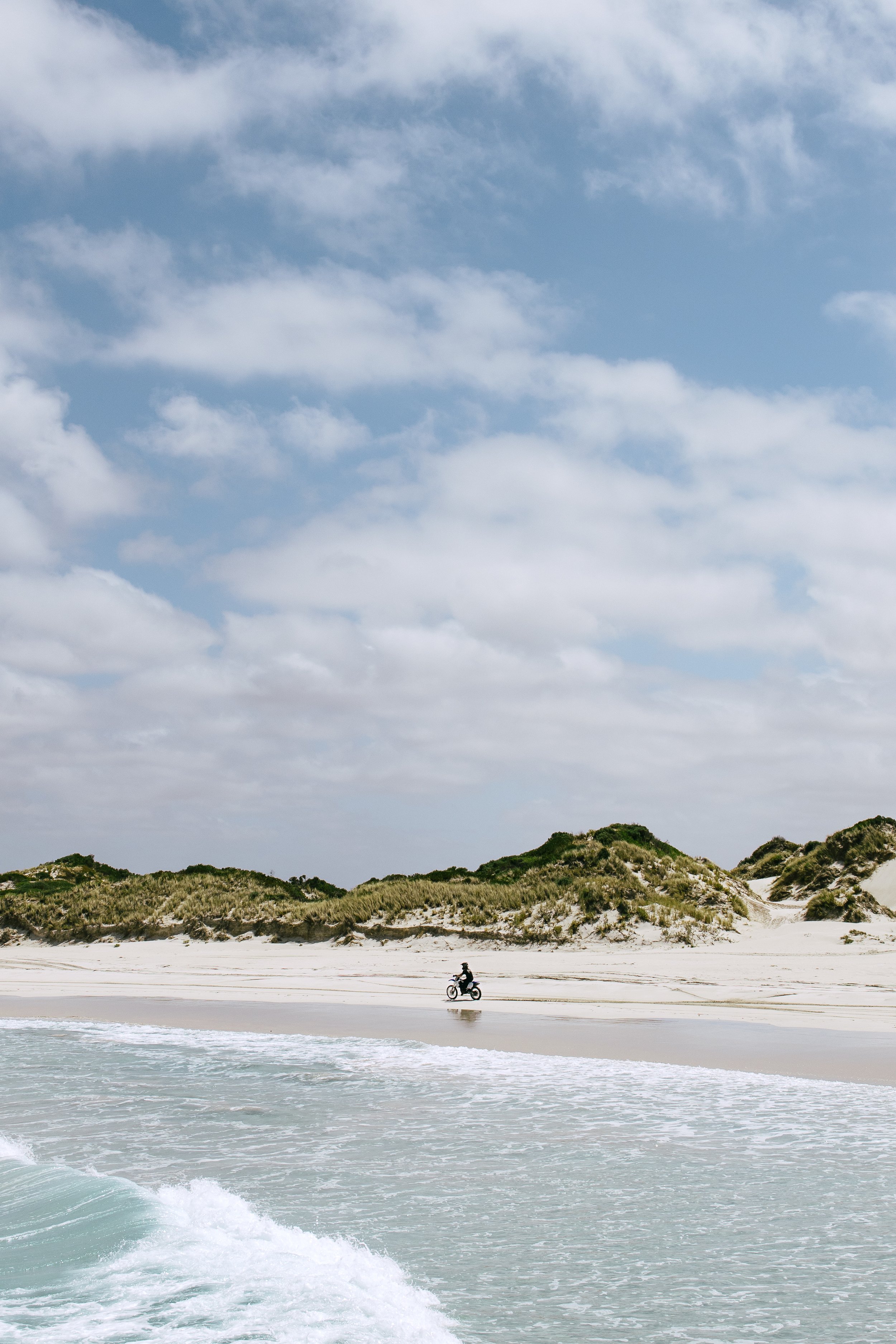Motorcycle driving on the beach in Esperance, Western Australia