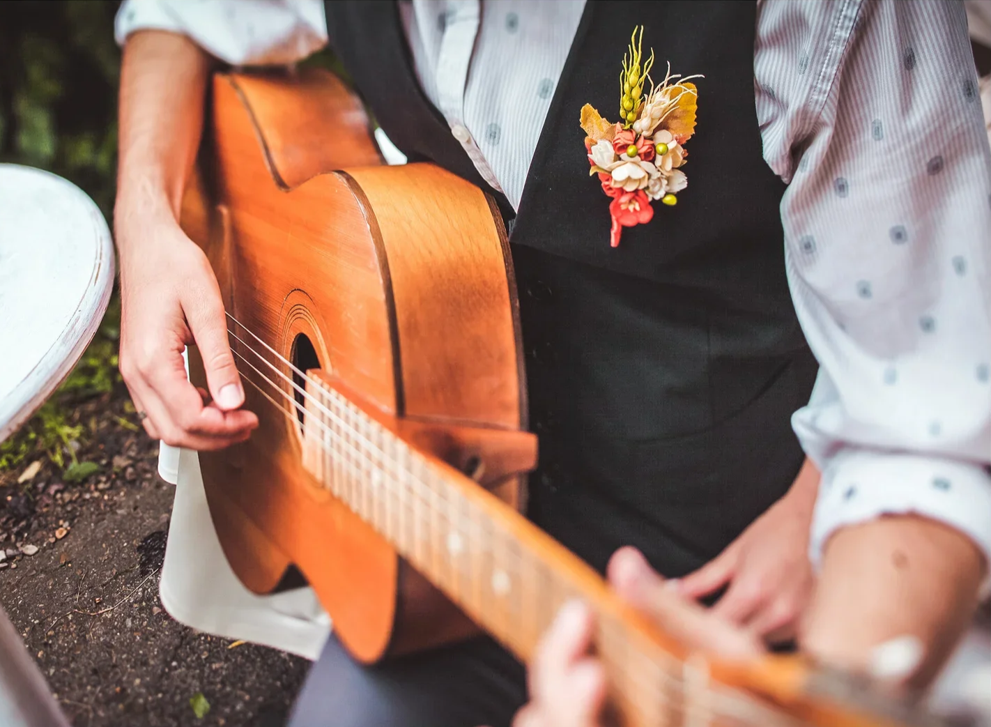 Acoustic Guitarist Playing in a garden