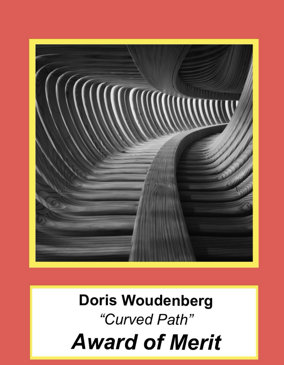 An award certificate with a cover image of a black and white abstract wooden sculpture titled 'Curved Path' by Doris Woudenberg. The certificate has a red background and yellow borders.