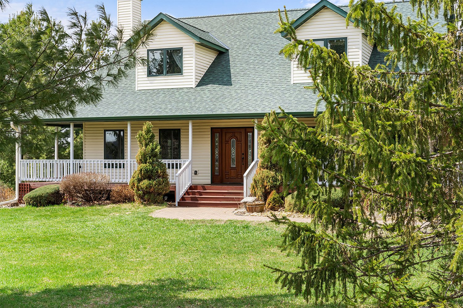 Residential real estate photography showing home exterior with front porch in Wisconsin