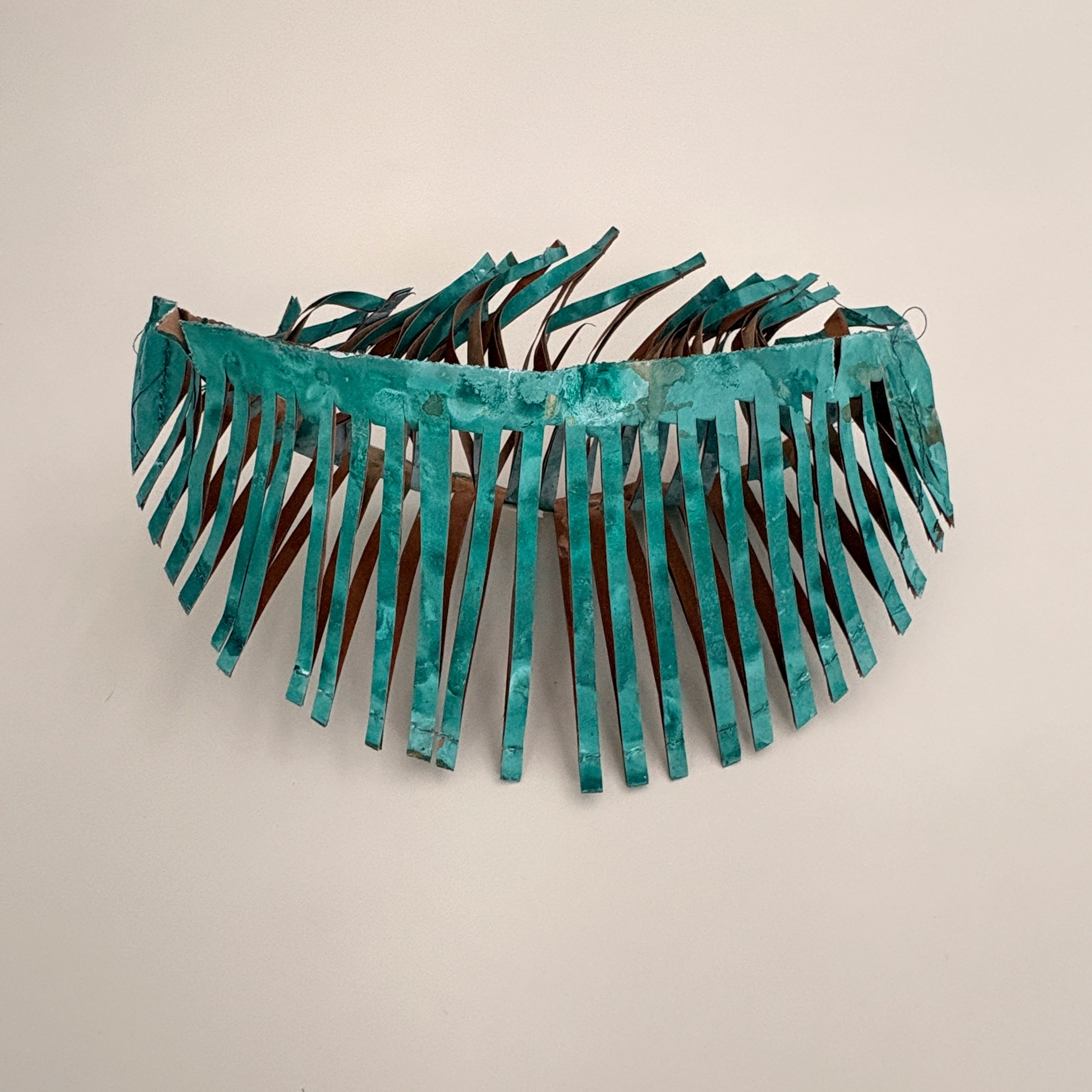 FP-RI-101
Jean Puerini, Wakefield, RI | 

This vessel, Inside Out, represents the experience of personal uncertainty while seeking safety and direction.
The altered form suggests the sensation of being turned inside out during times of major change.