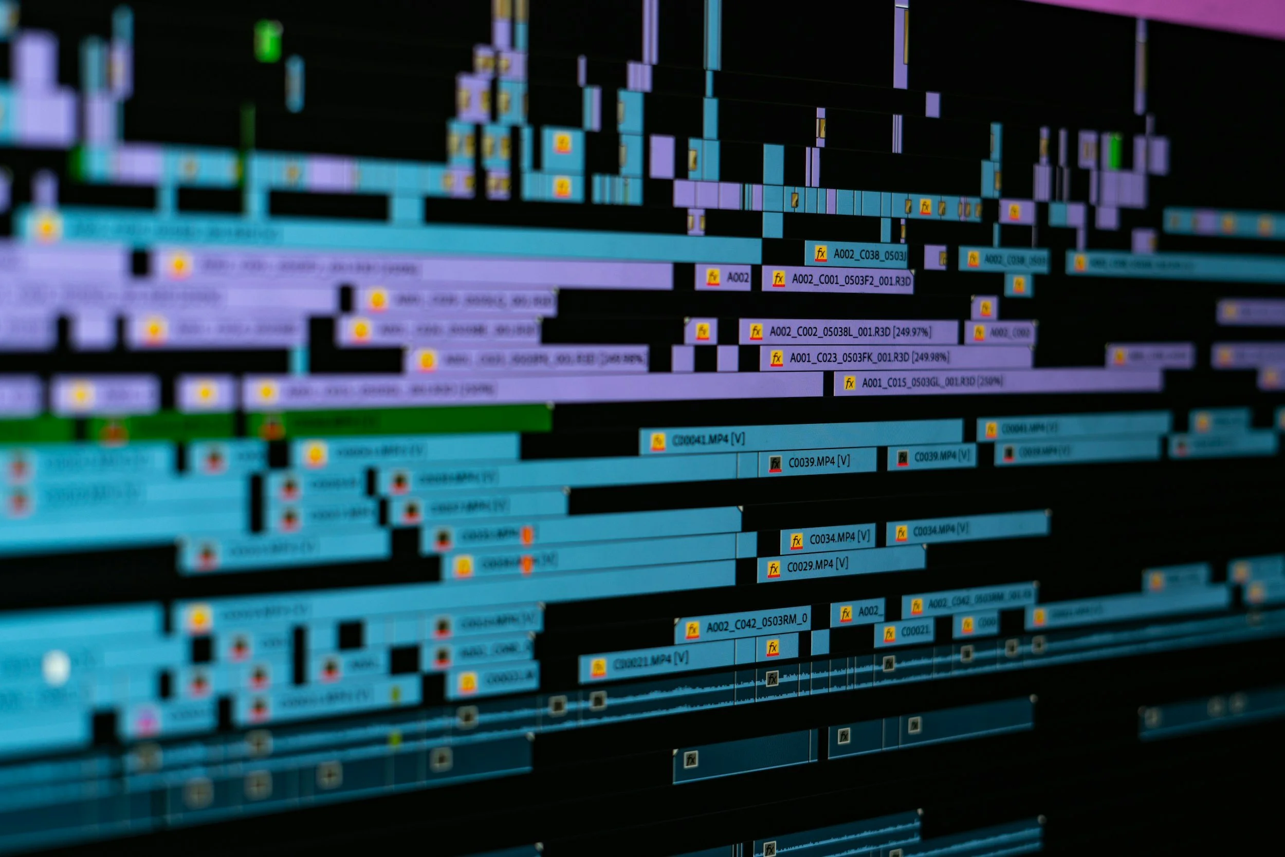 Video editing timeline with multiple clips arranged across tracks on a computer screen.
