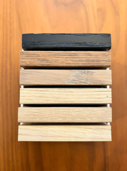 Wood flooring samples showing a range of light, natural, and dark finishes