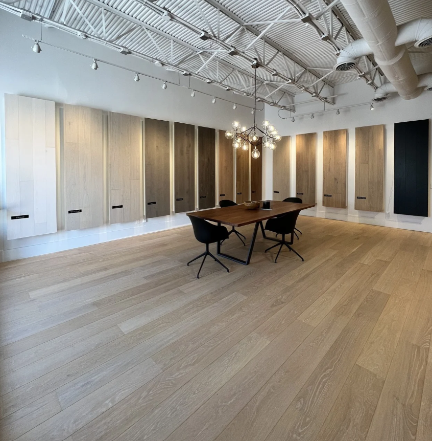 Wynwood Floors showroom with wood flooring and wall-mounted flooring samples