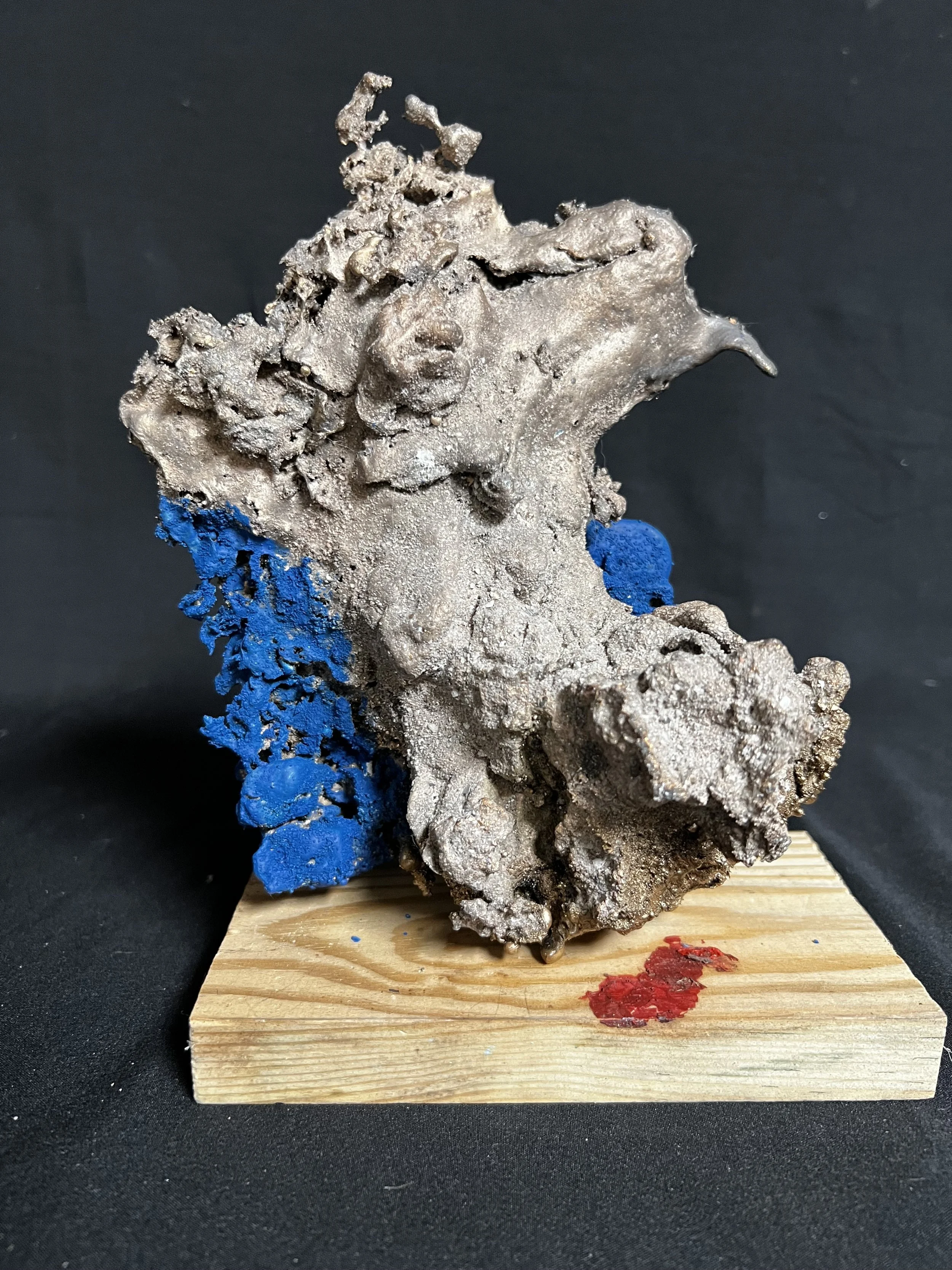 Torso Reclining on Blue Blanket     8"x6"x3" Bronze, Wood, Paint    $1200.00