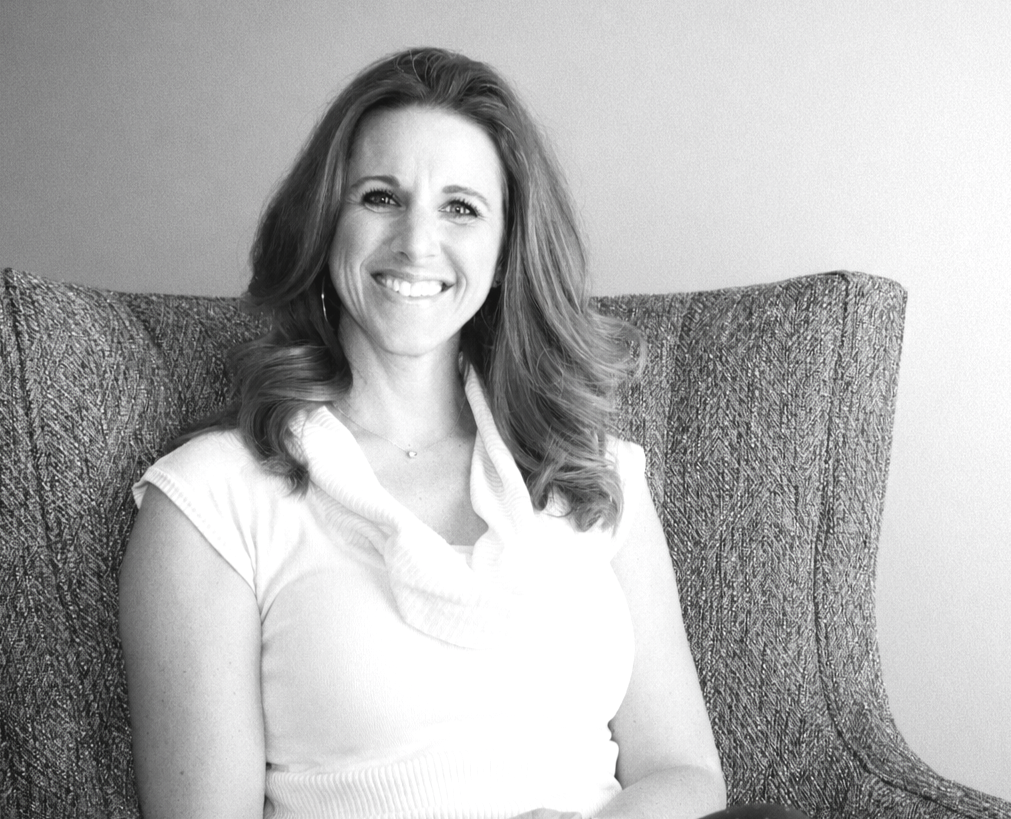 Mimi Crisenberry smiling in natural light, therapist and founder of Liberty & Light Counseling